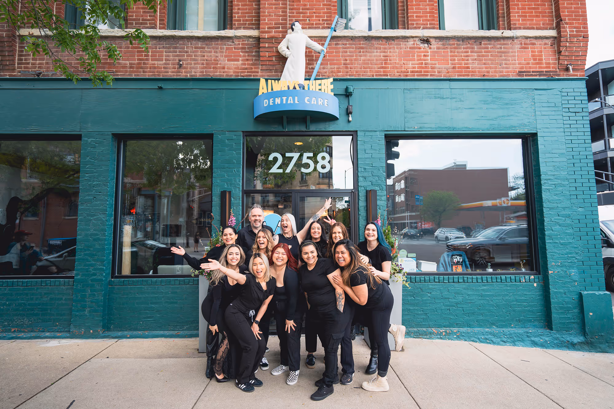 A group of always there dental team members standing outside of a the dental office located in chicago.