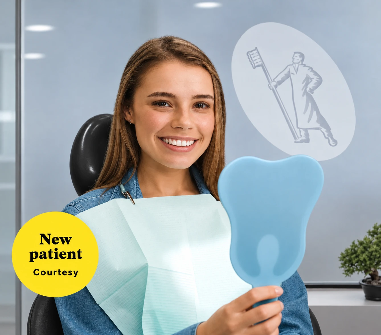 Smiling patient in a black dental chair holding a tooth-shaped hand mirror.