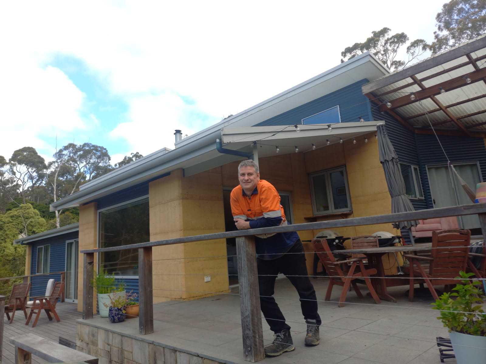 Jeremy standing outside his home