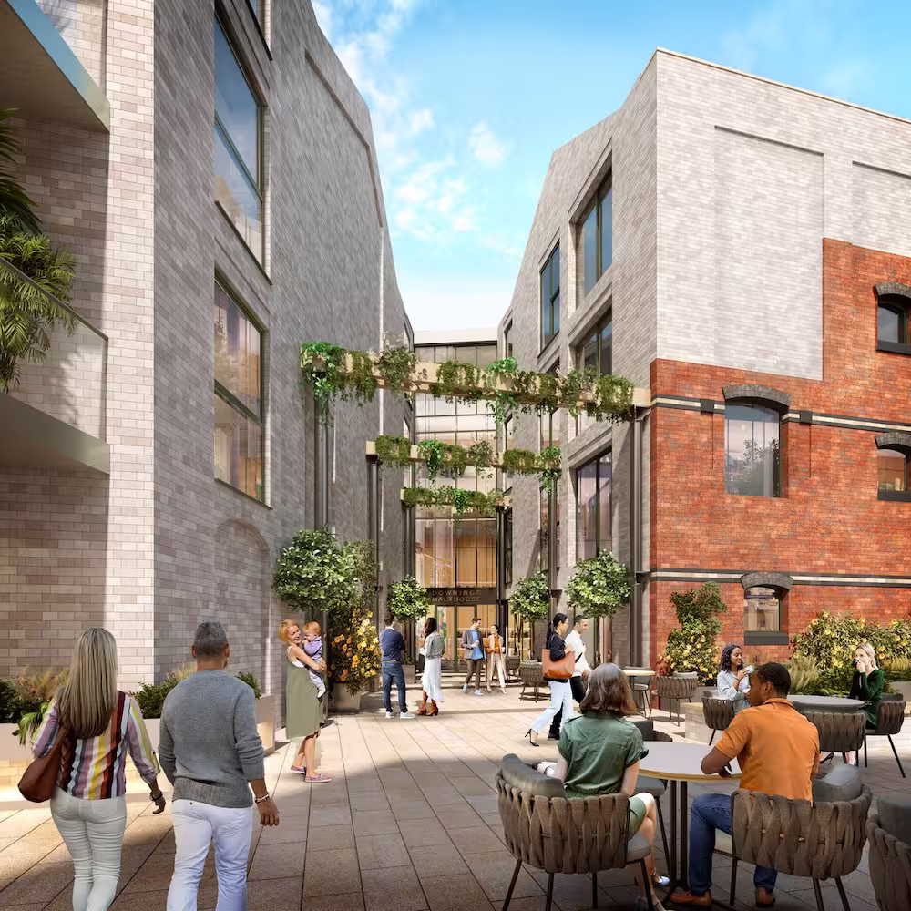 Courtyard scene of The Downings, with people relaxing outside
