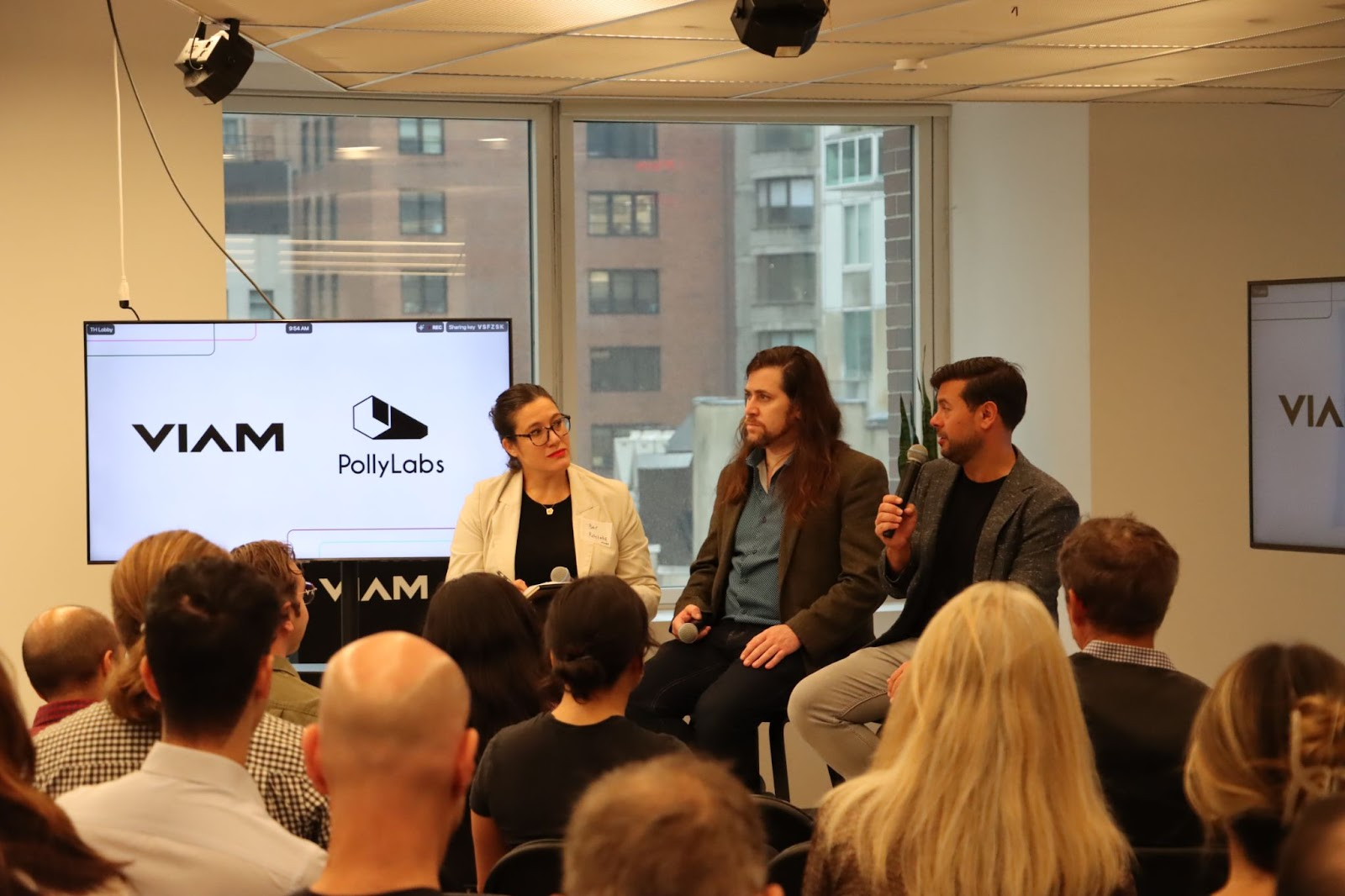 Eliot Horowitz, Bar Pereg, and Ben Soltoff sitting on panel in front of an audience in the Viam HQ