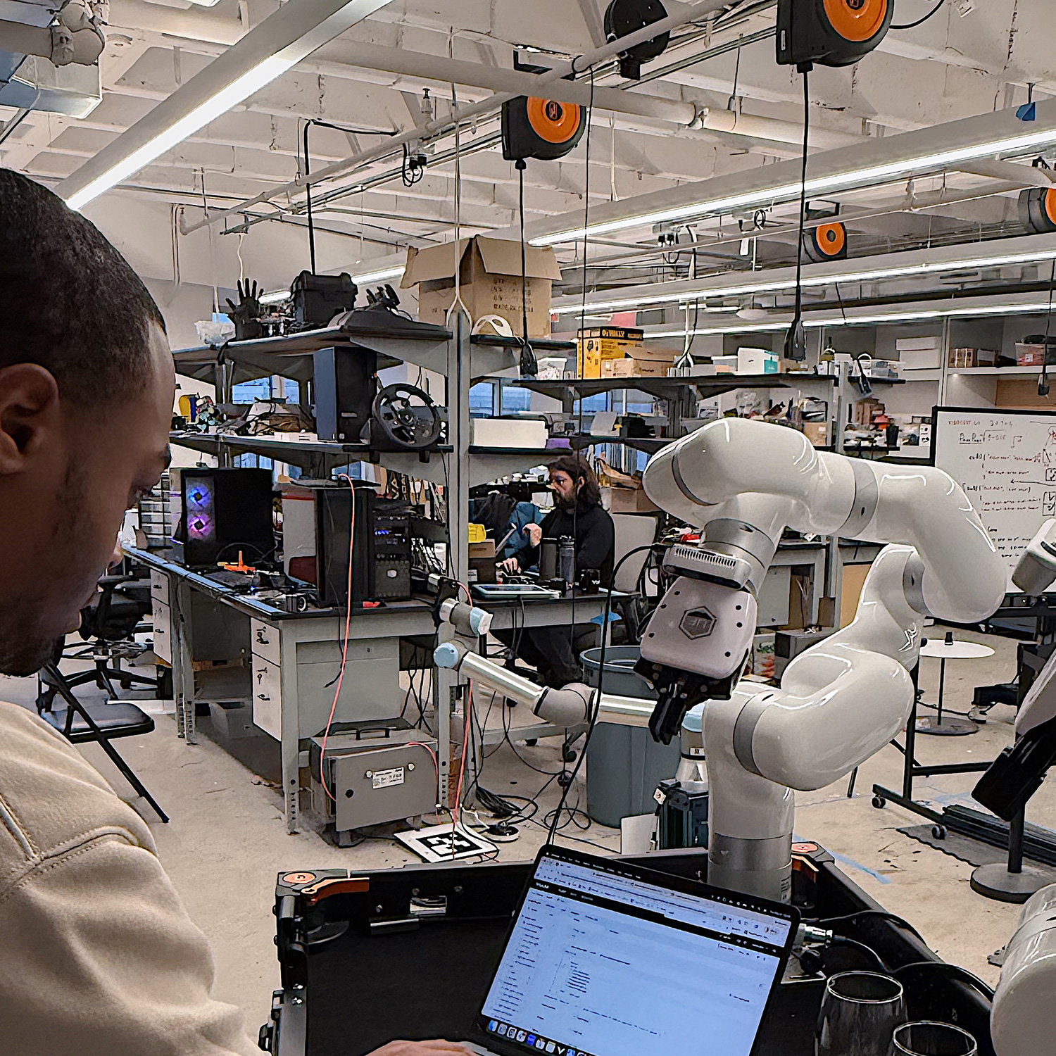 A Viam employee working in our robotics lab