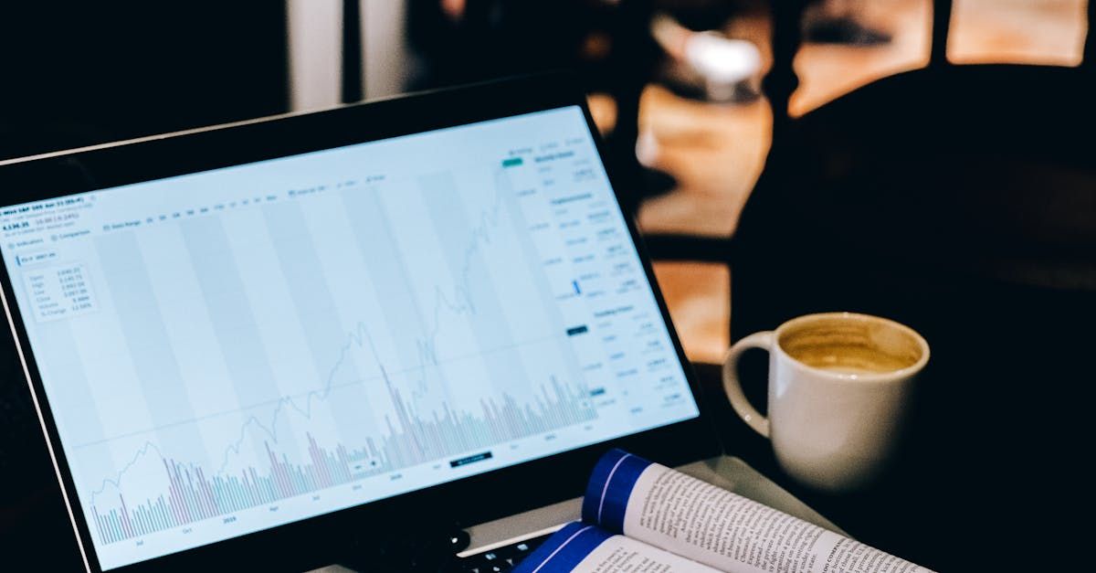 Marketer analyzing website performance on tablet in café