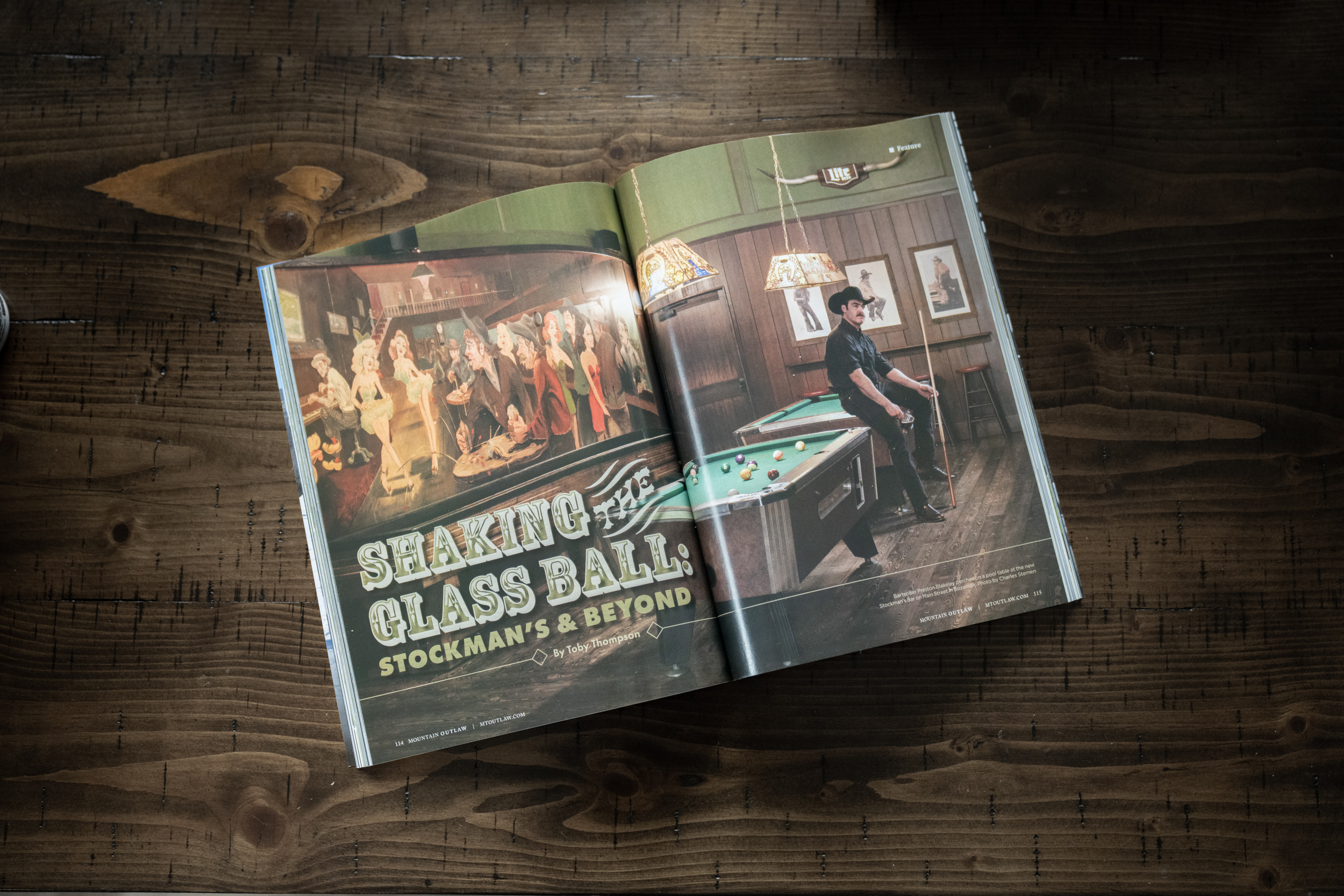 Magazine spread with full-bleed photography of a rustic bar, with a man sitting at a pool table.