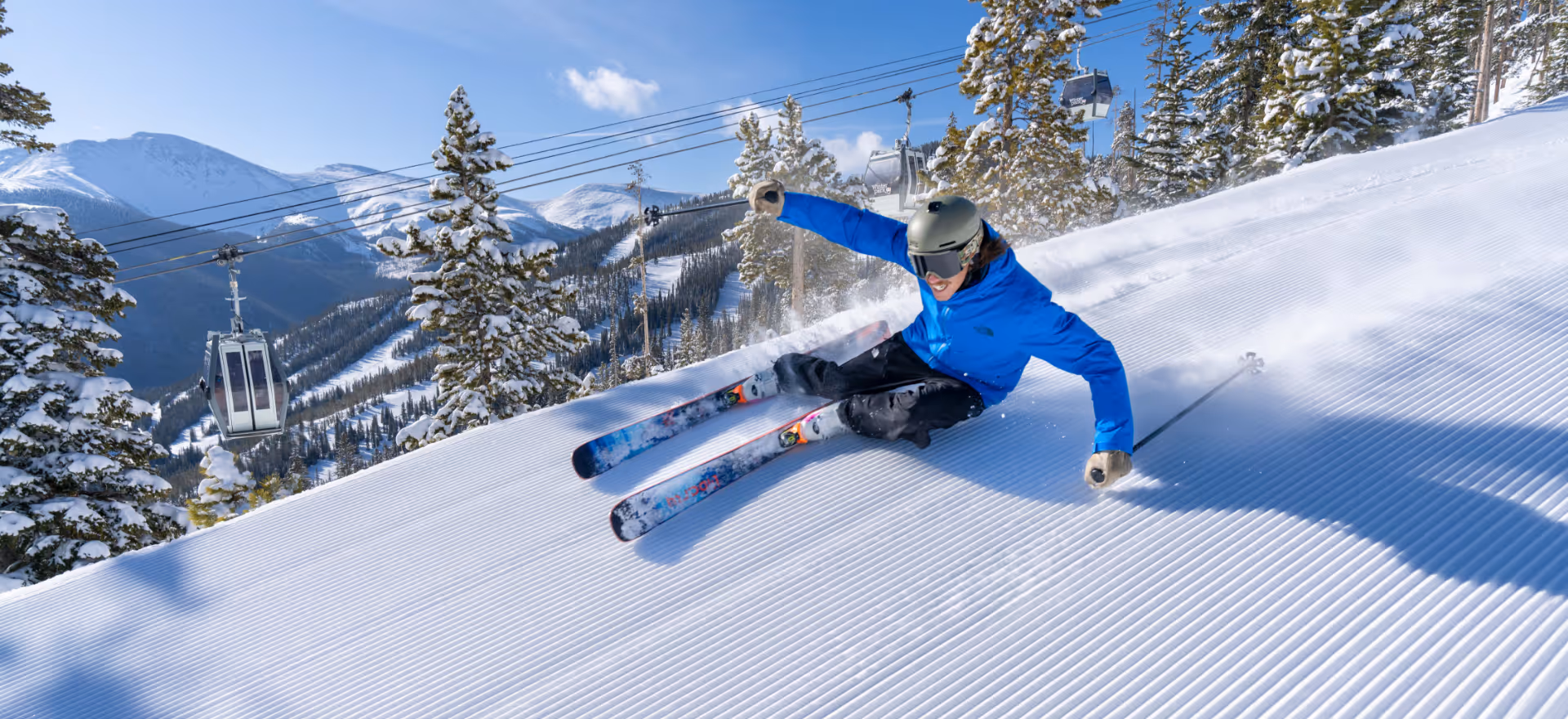 A skier ripping some groomers