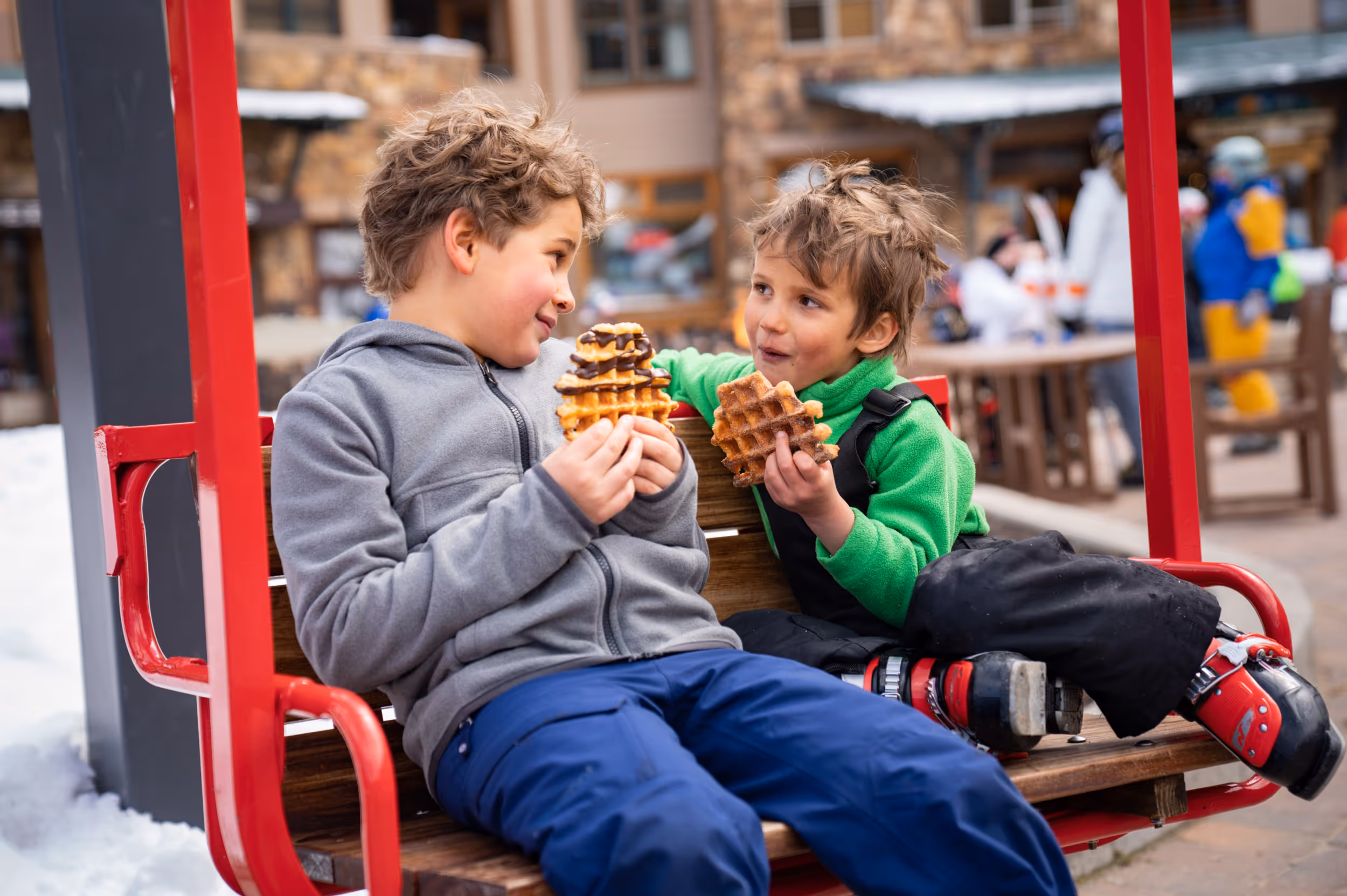 Some kids enjoying their after-ski waffle 