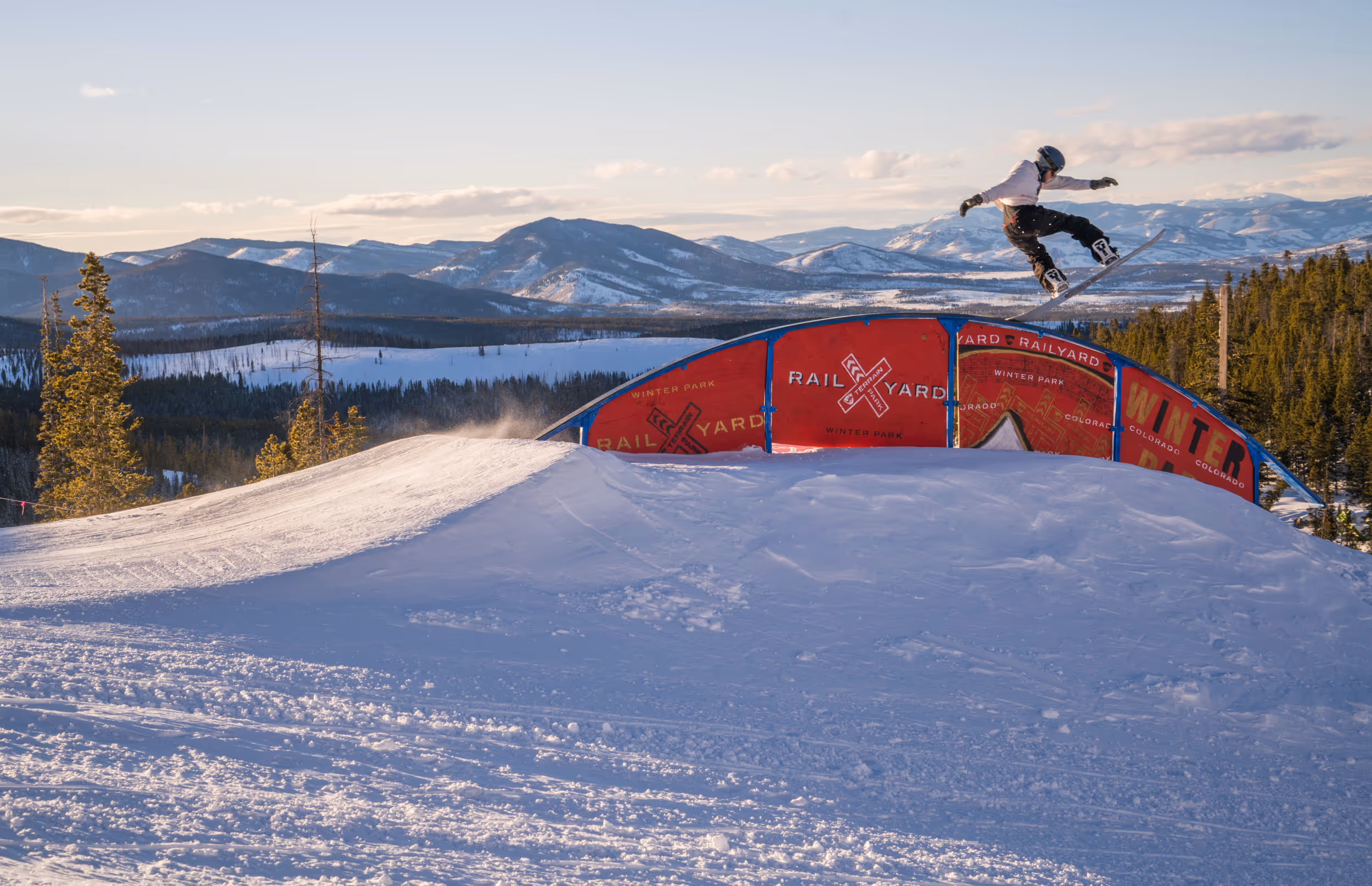 A snowboarder enjoying the terrain park 