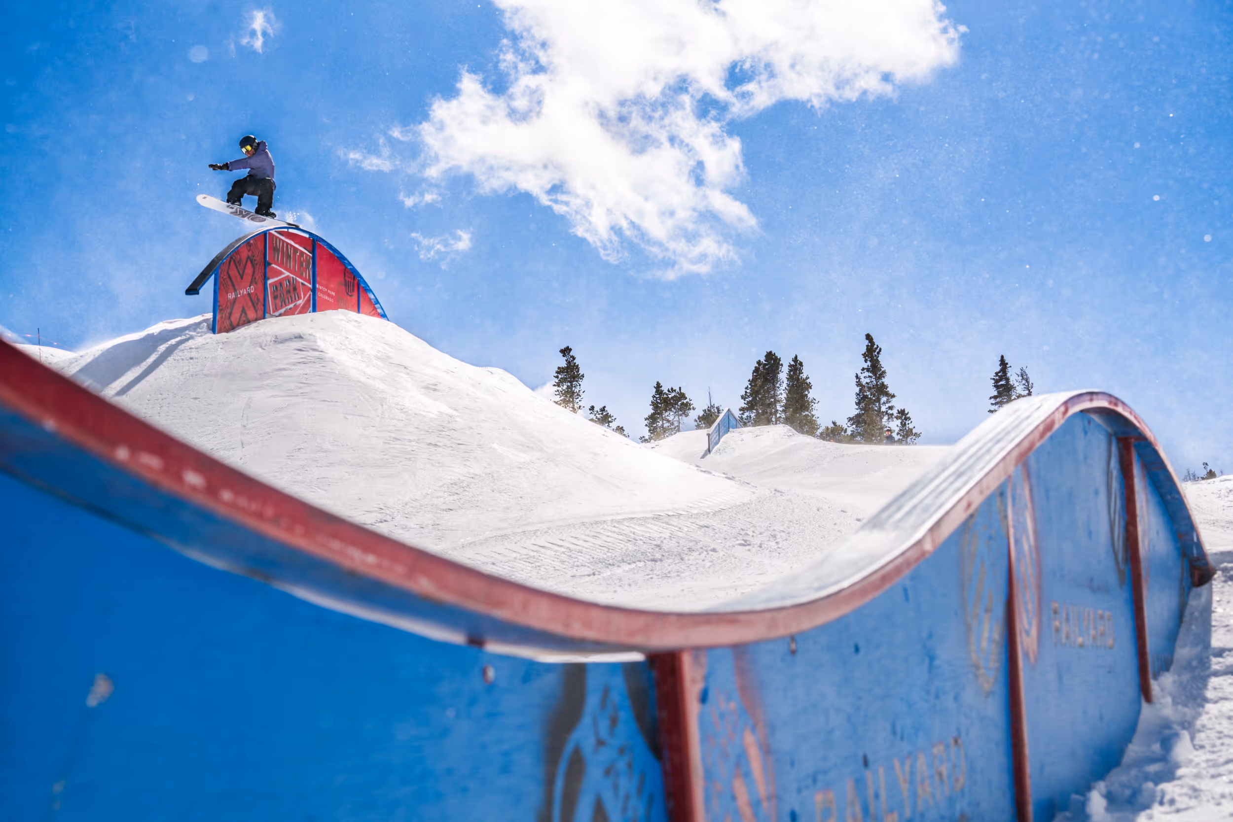 A snowboarder enjoying the terrain park 