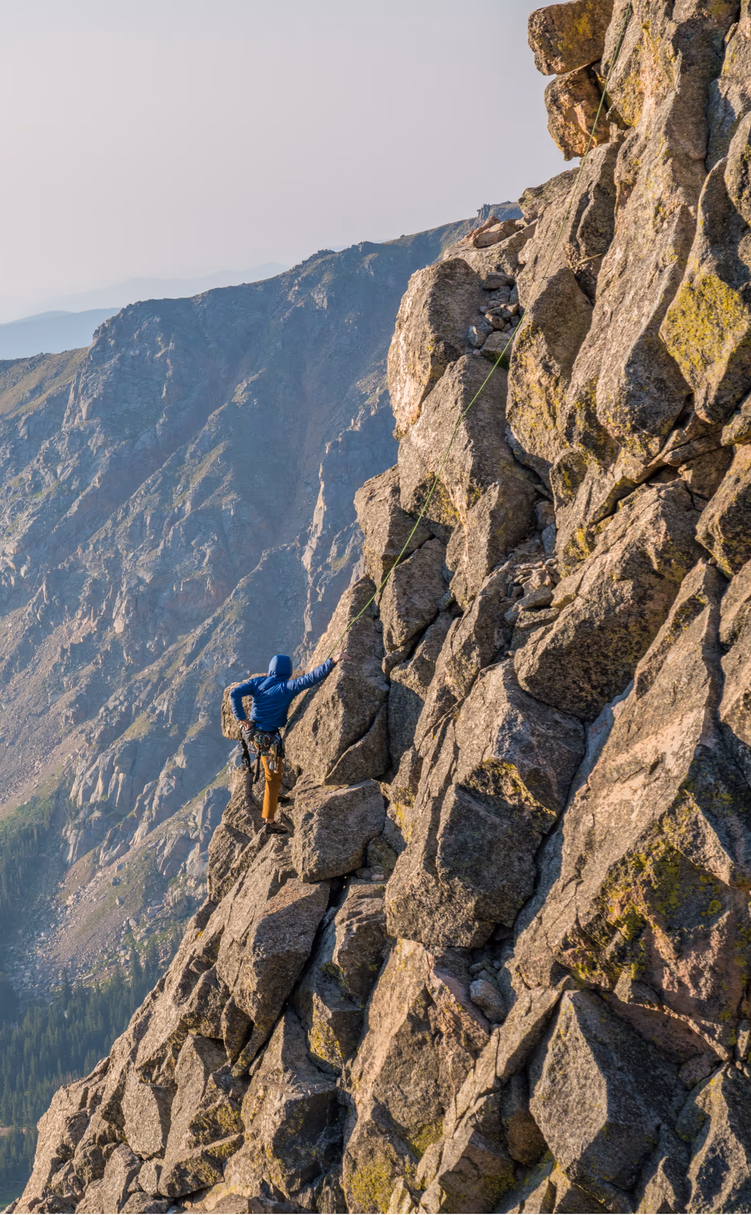 Some climbers roped up and climbing mid-route 