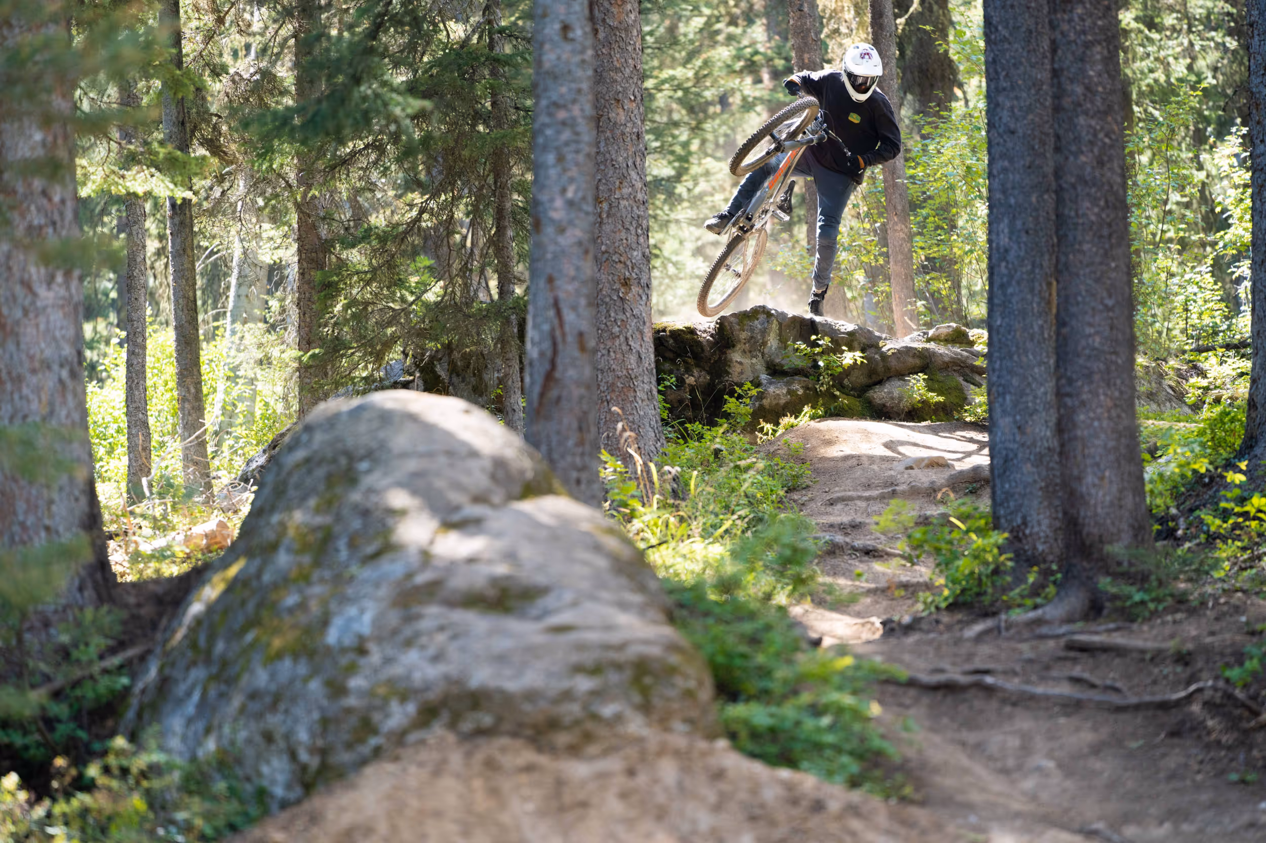 Mountain biker footplant trick