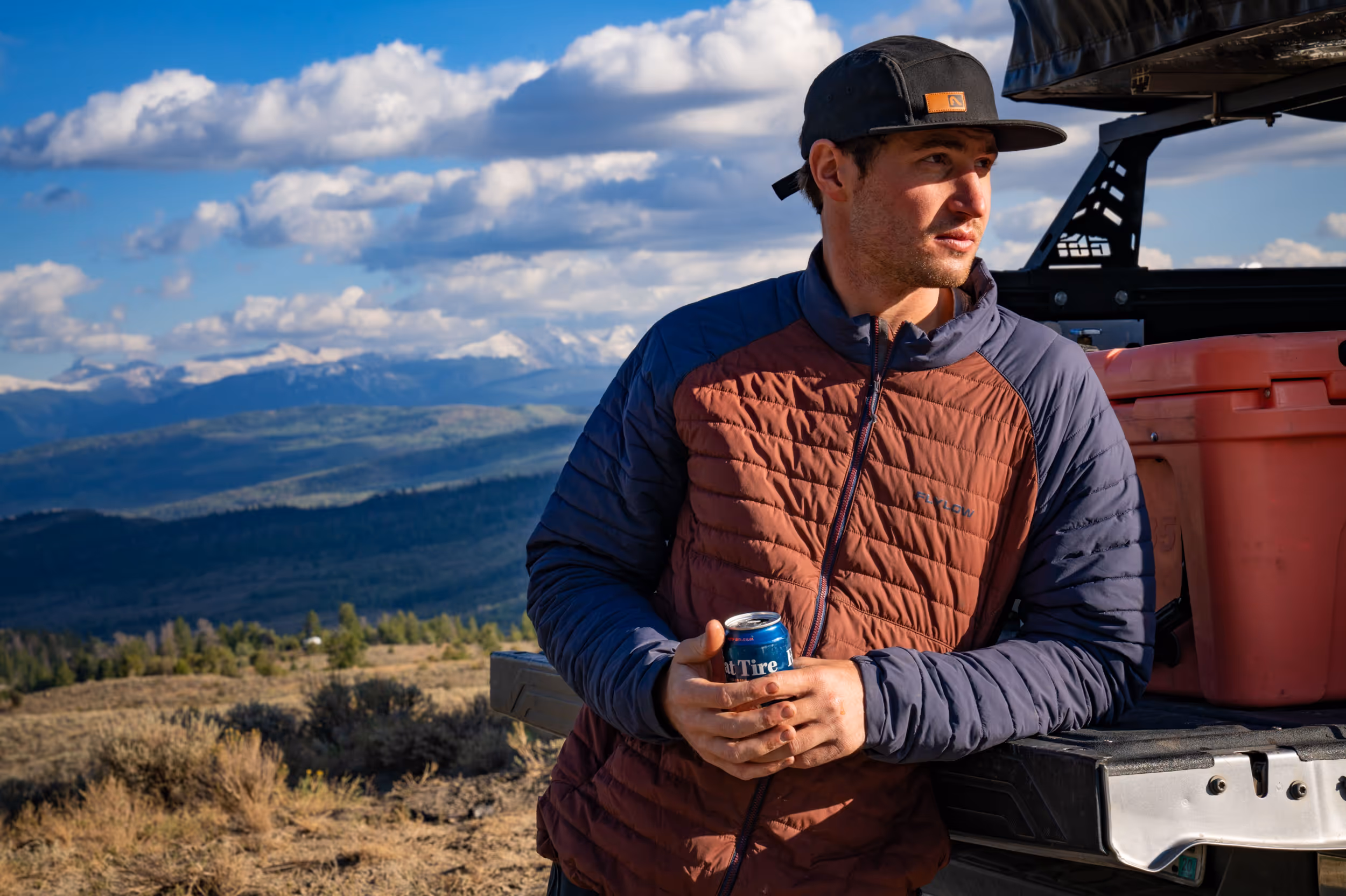 A mountain biker enjoying a beer post ride 