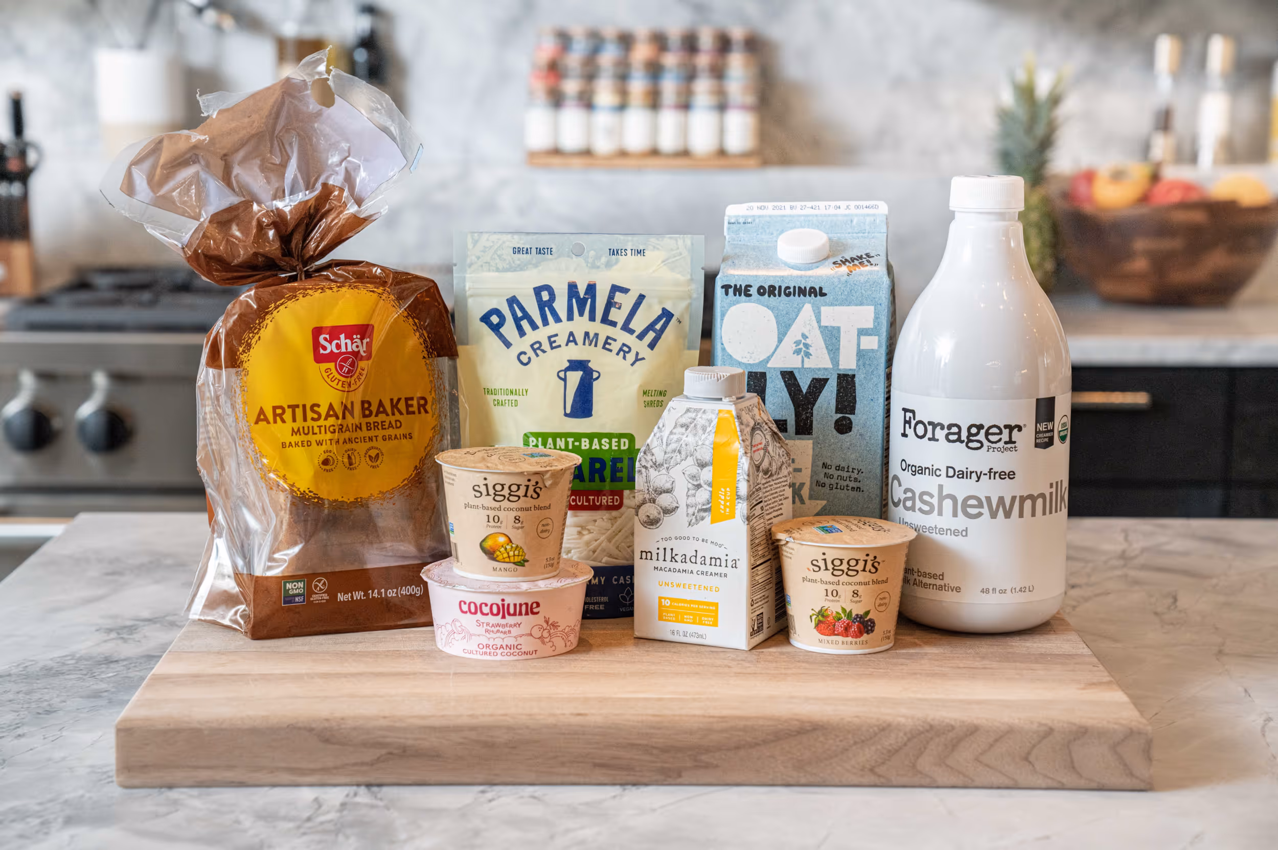 A collection of grain and dairy products arranged on a marble counter top 