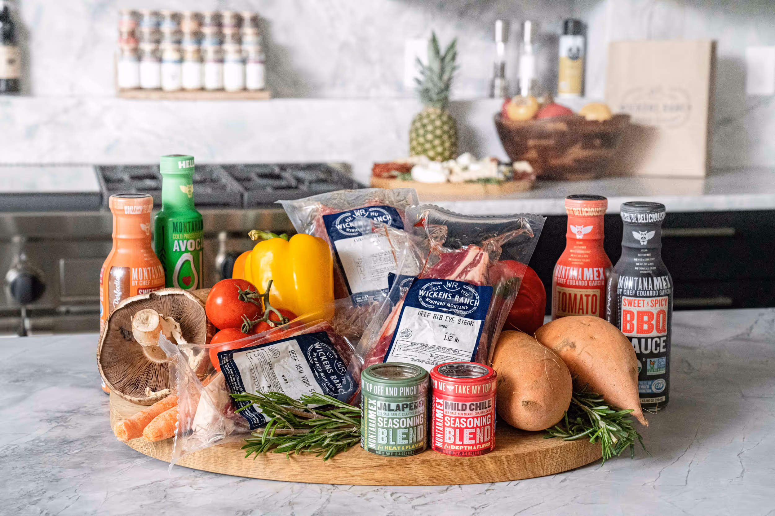 A collection of local produce and food brands on a marble countertop 