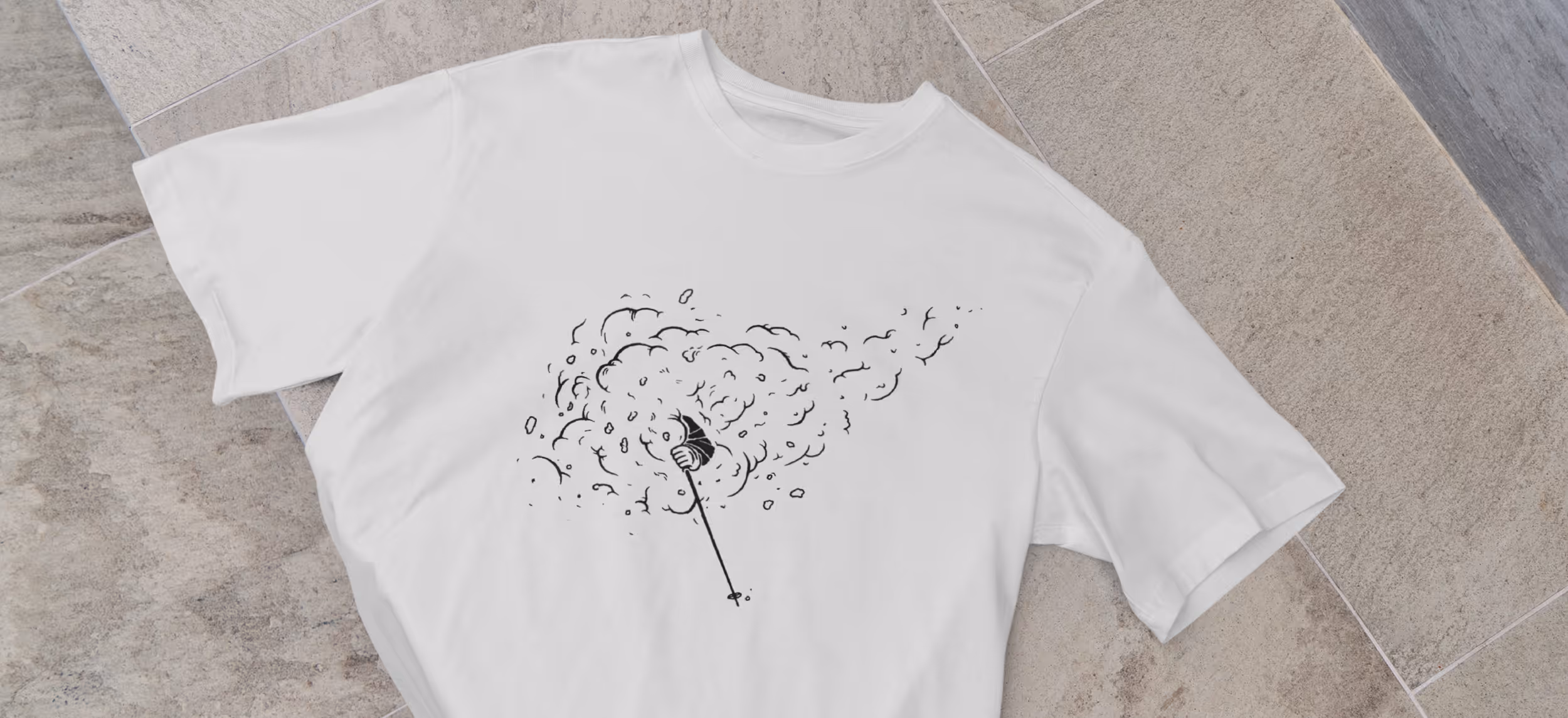 A t-shirt with a graphic of a skier getting face shots while skiing 