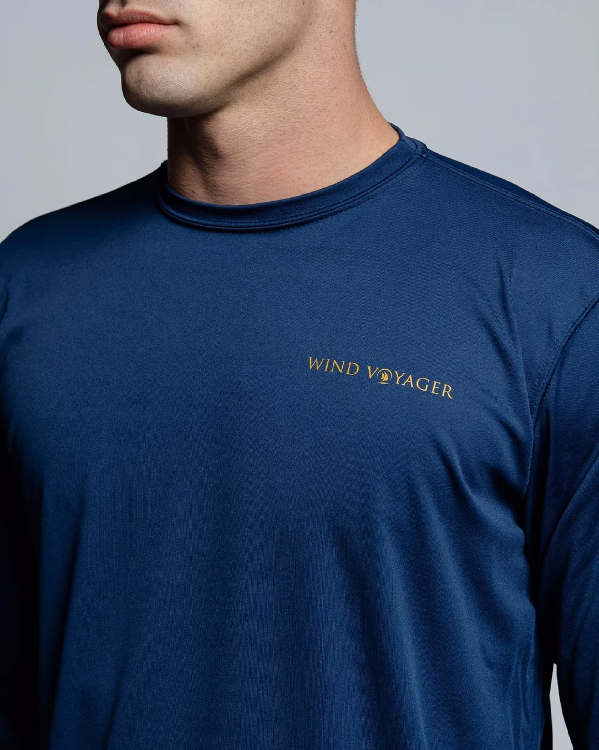 Man wearing dark blue wind voyager sun shirt 