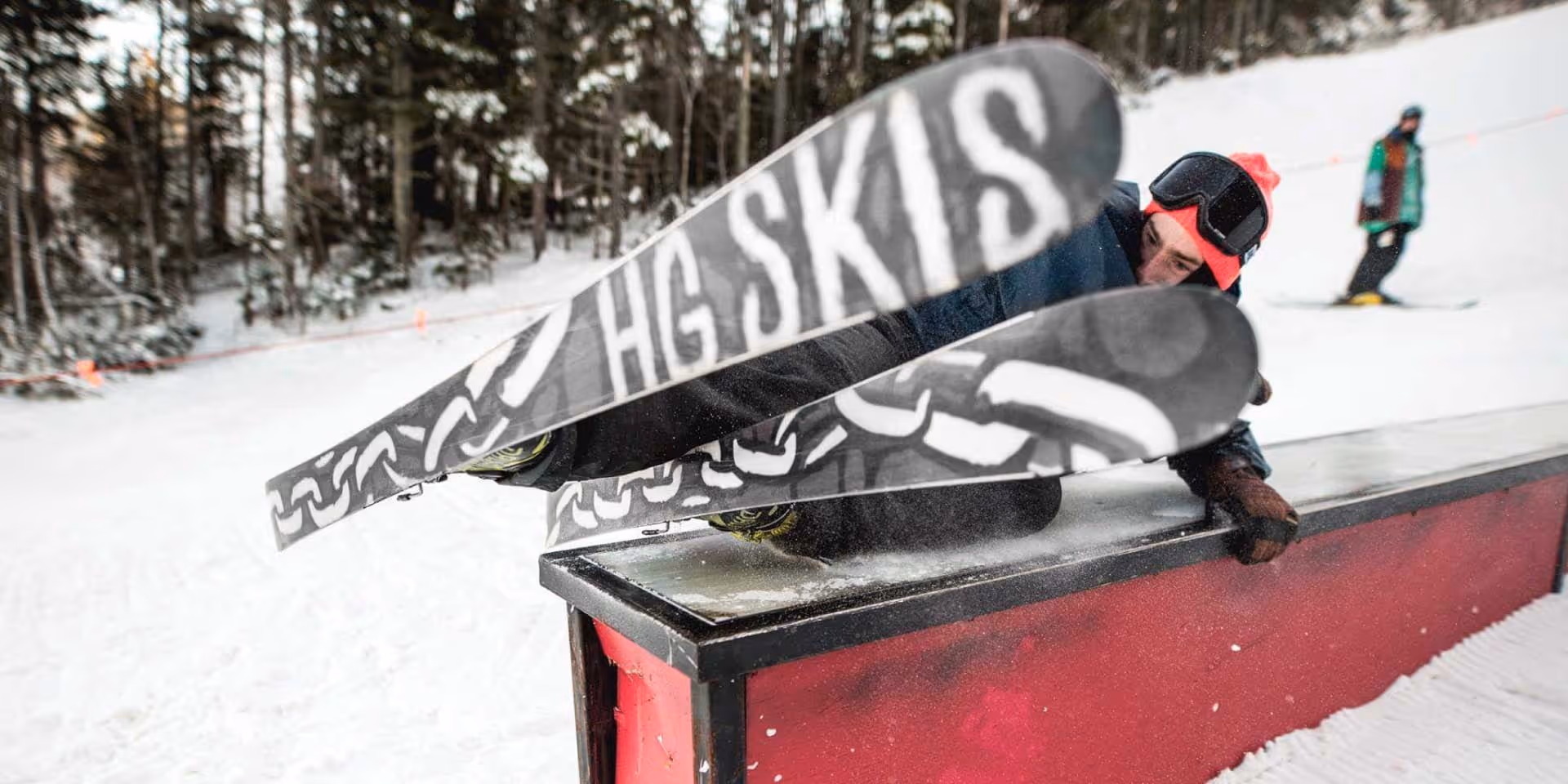 A skier exciting a obstacle in a ski park with the HG skis 