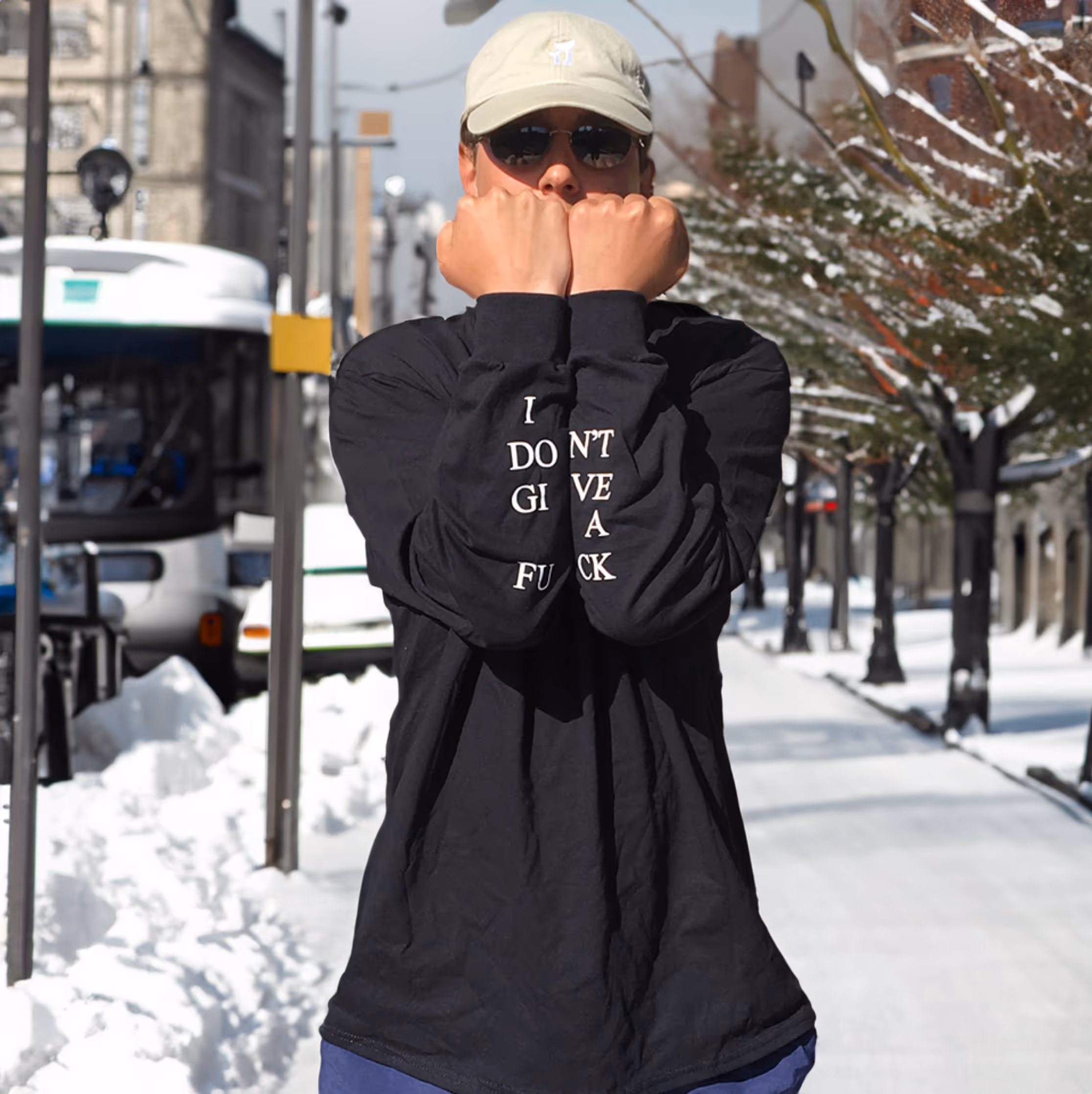 A man wearing an IDGAF long sleeve shirt 