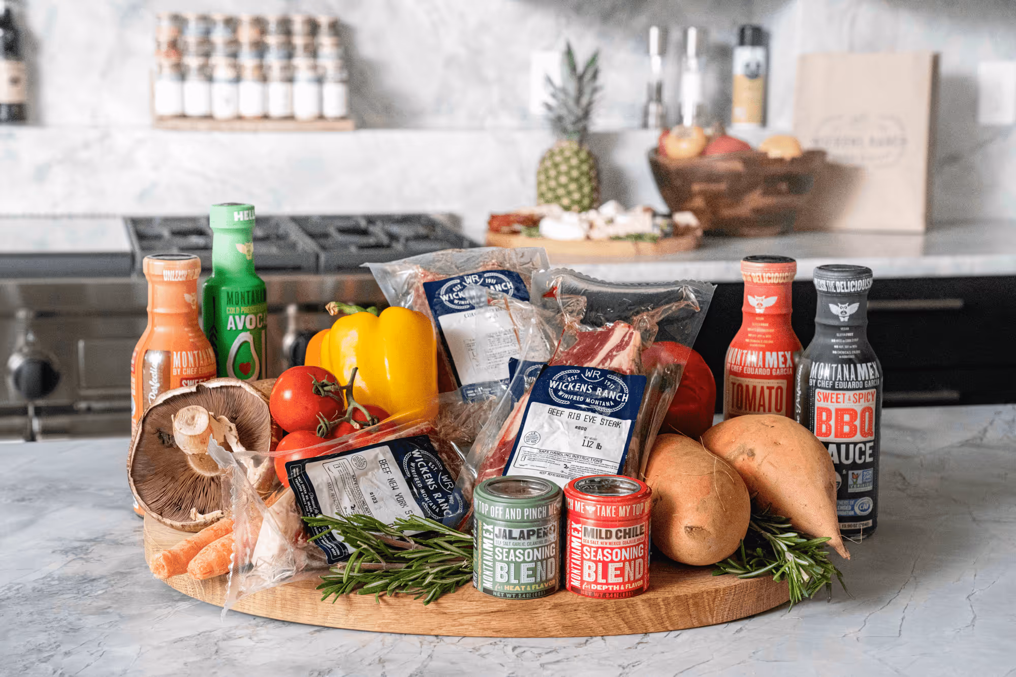 A collection of local produce and food brands on a marble countertop 