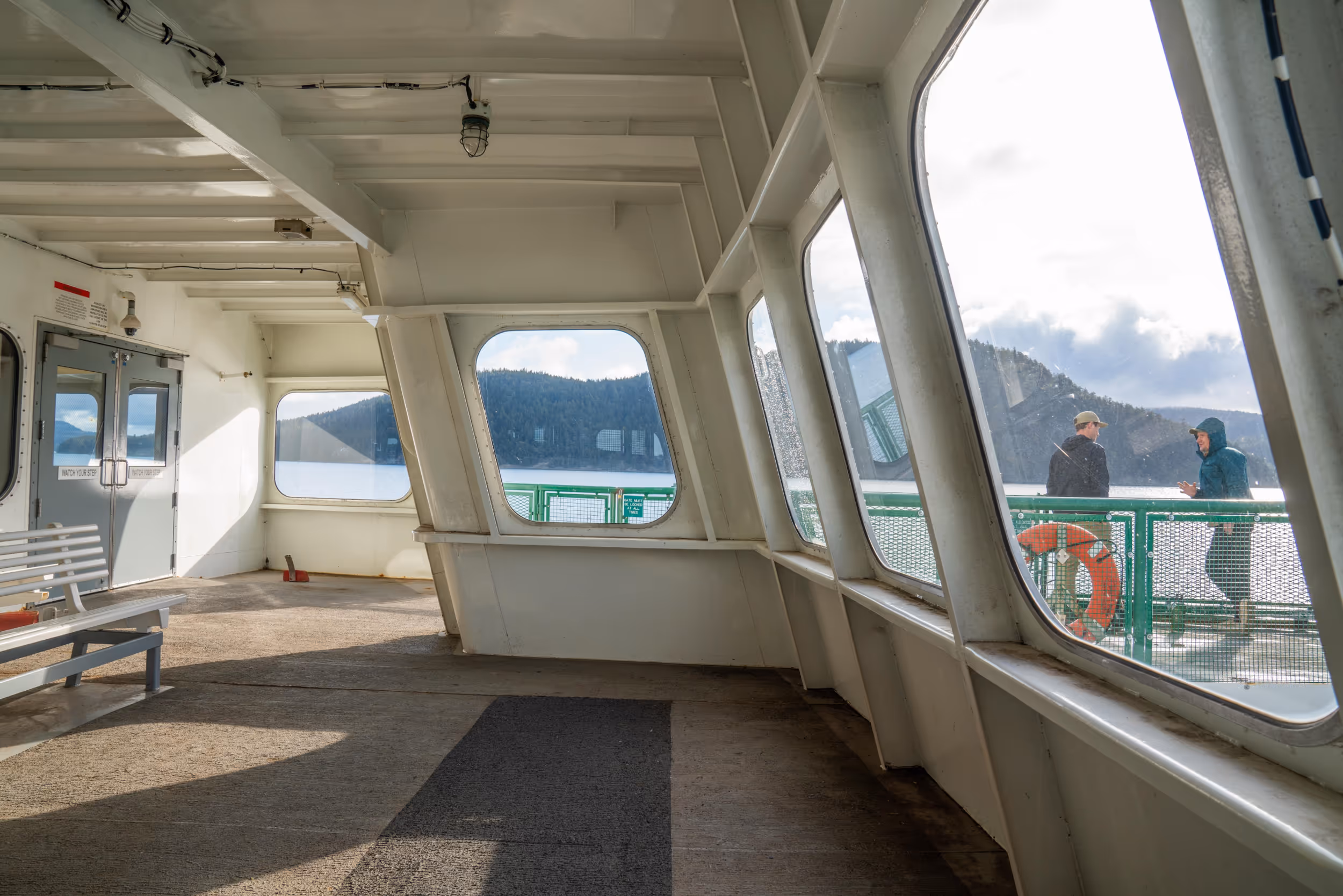 A sunlit interior of a PNW ferry