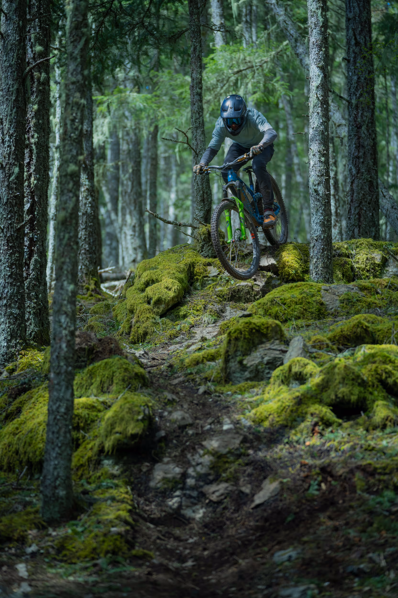 A mountain biker getting some air off a jump 
