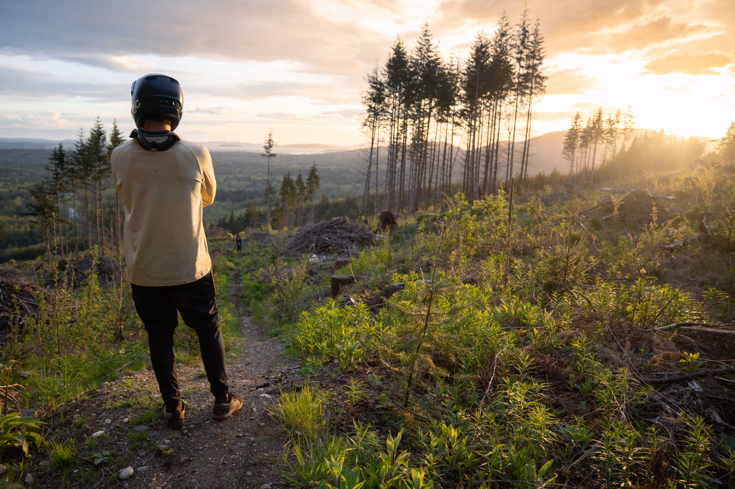 A mountain biker appreciating the sunset 