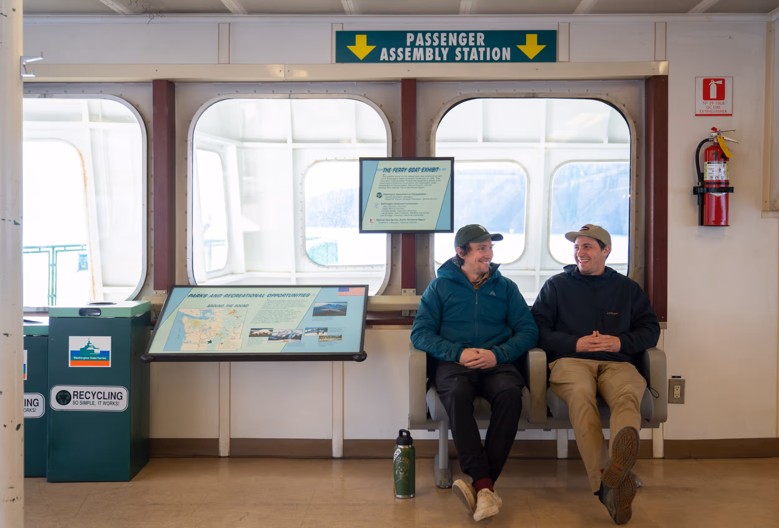 Some friends enjoying a ferry ride on a bench 