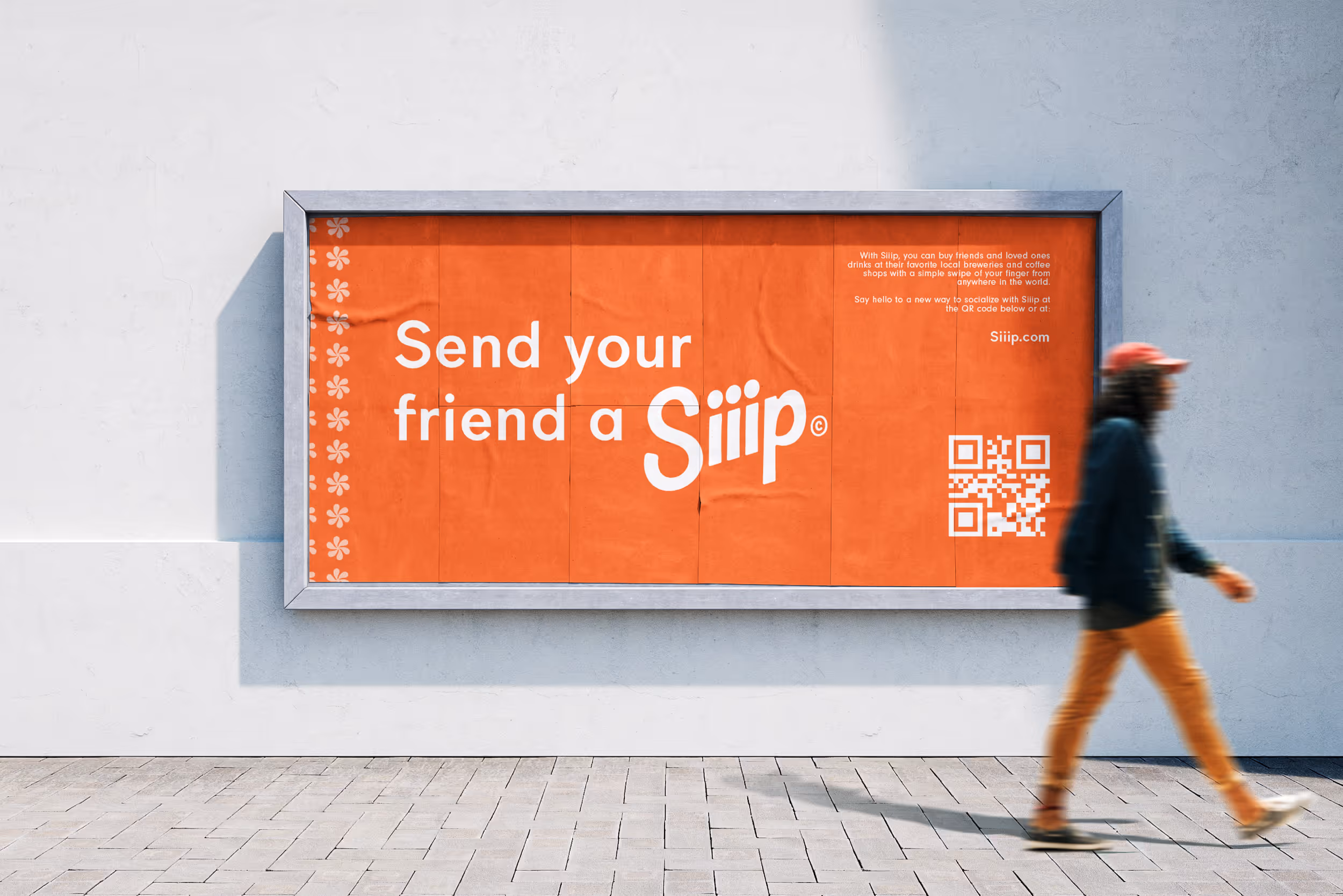A man walking in front of a poster for Siiip