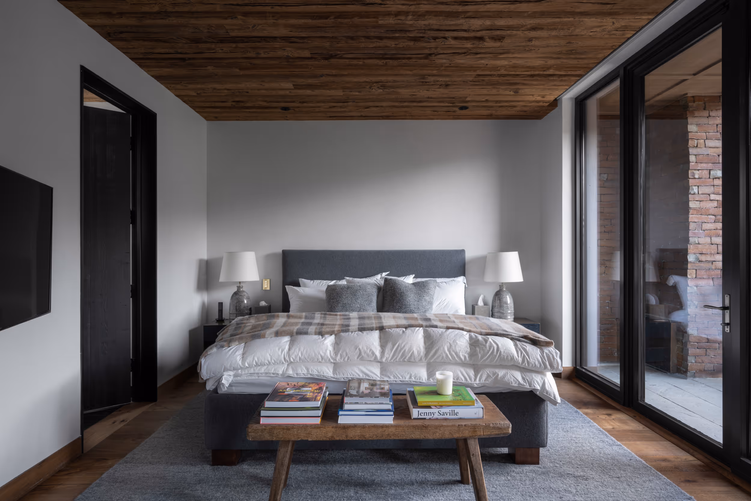 A large, luxurious, bedroom with a  comfy looking bed in the middle 
