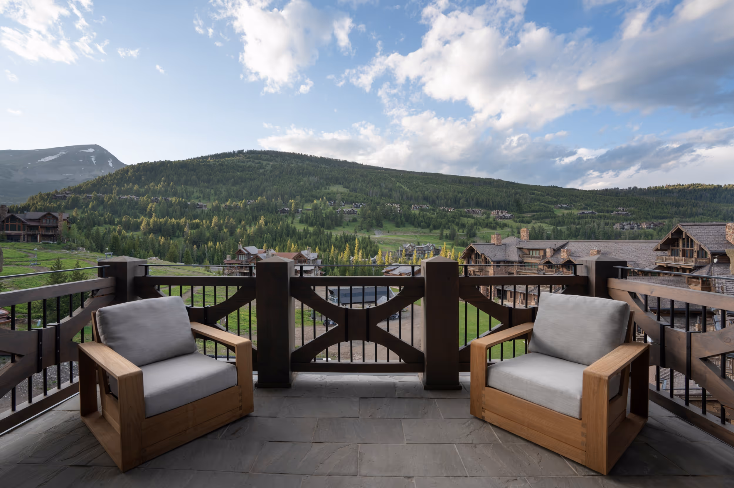 2 cozy chairs on the patio looking over the mountains