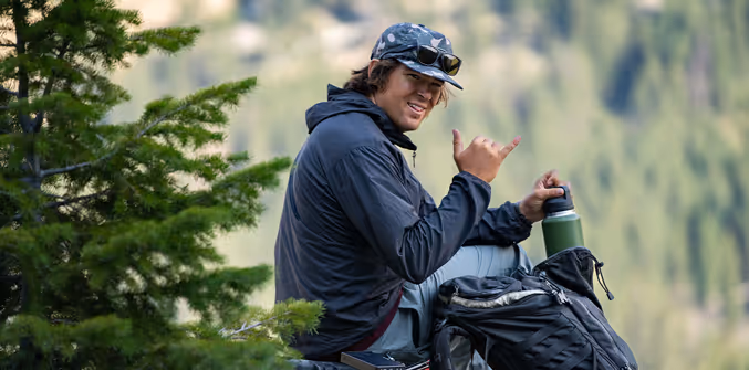 A photo of Ben Dann giving the shaka 