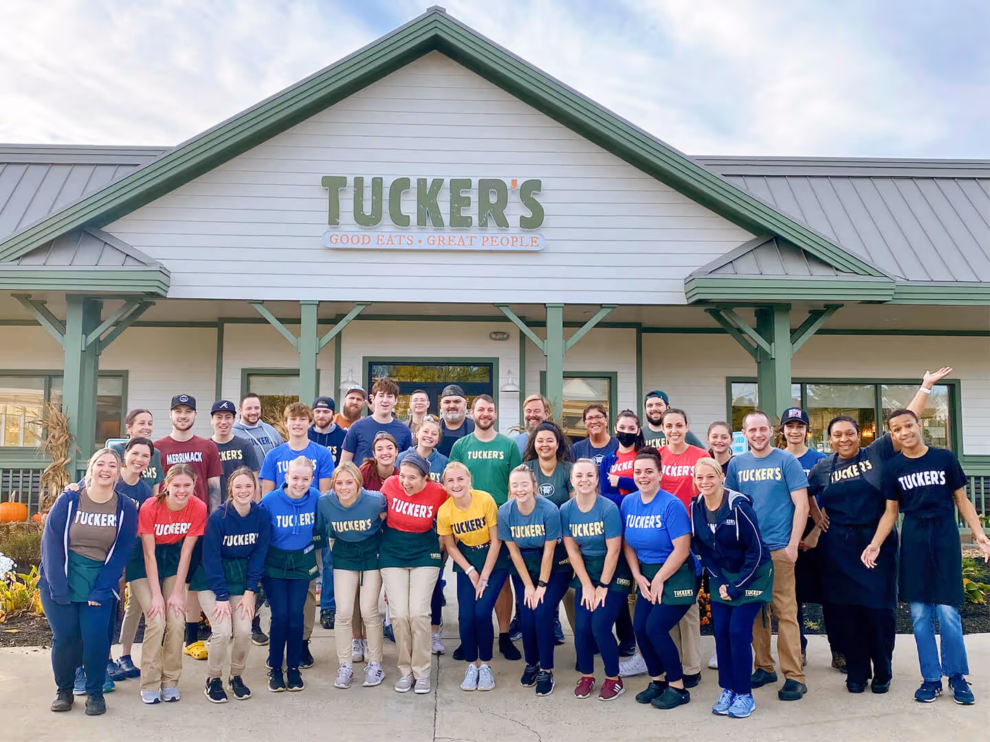Tucker's team posing in front of Bedford, NH location