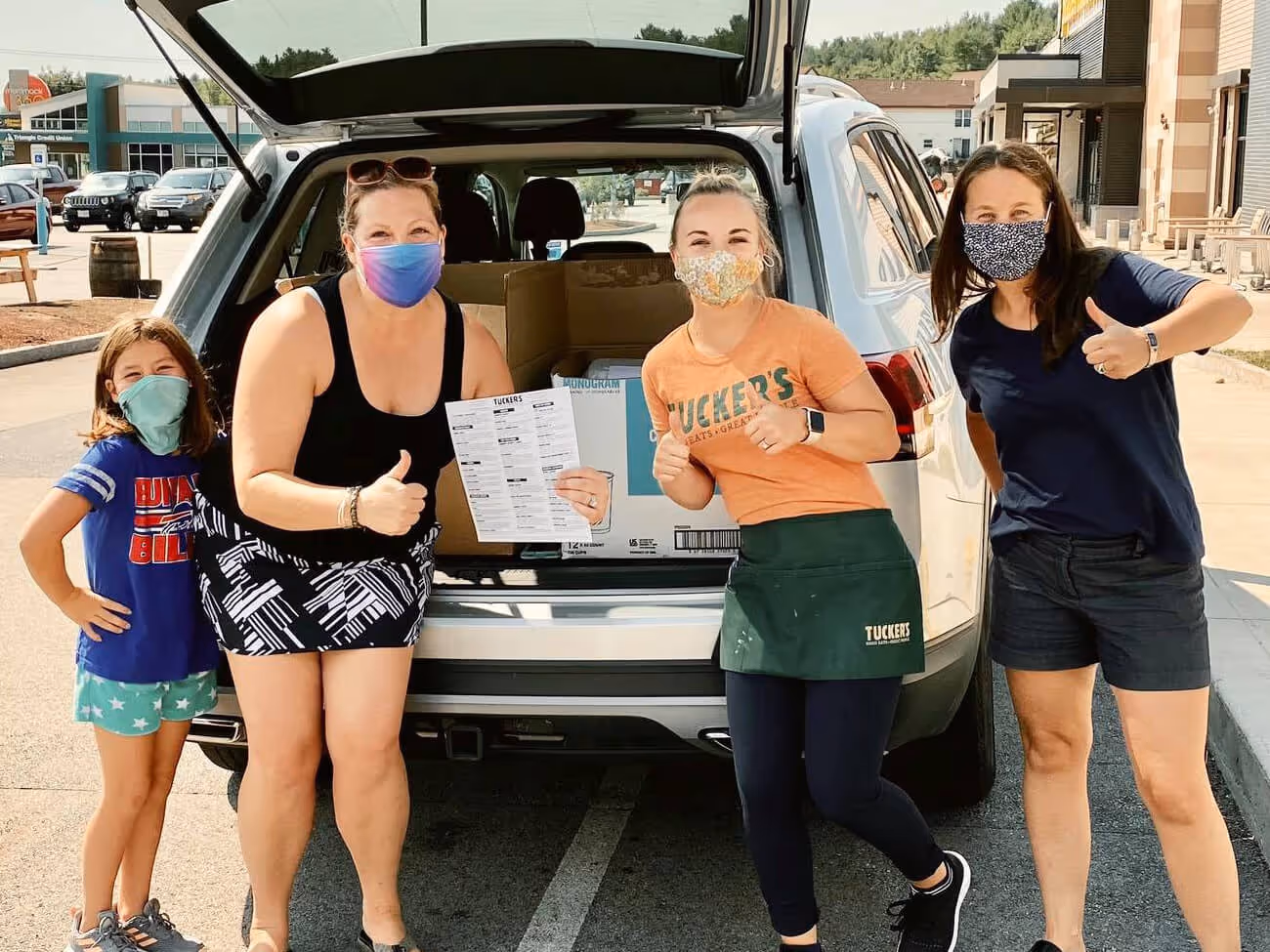 Tucker's employee loading donations into vehicle