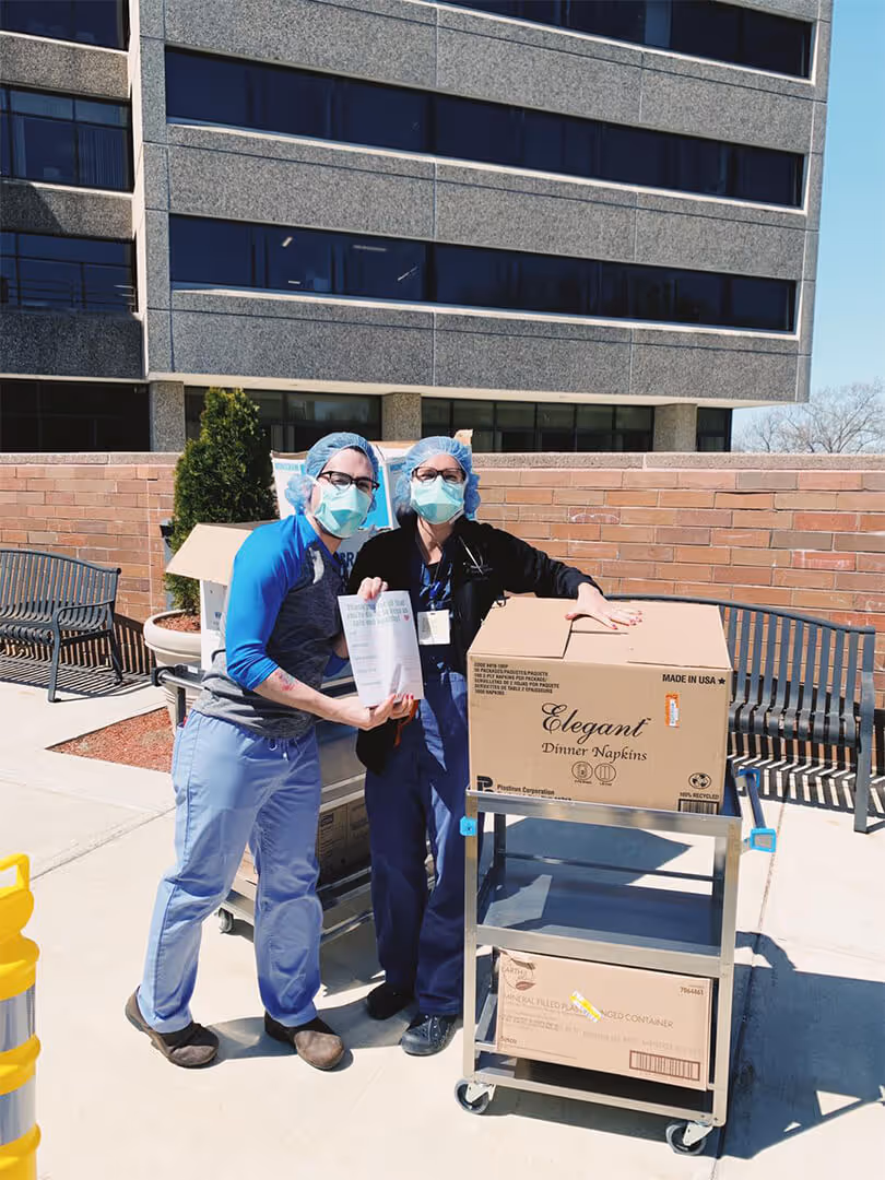 Two people accepting a donation