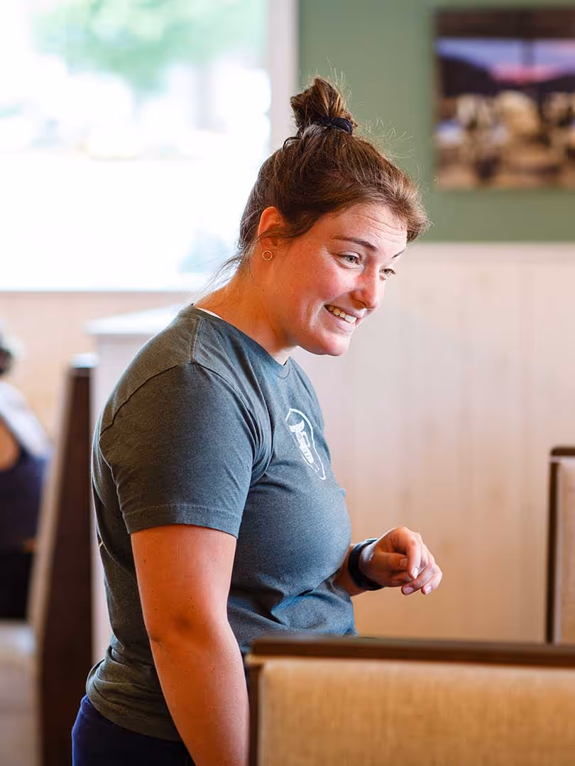 Waitress assisting a table of guests