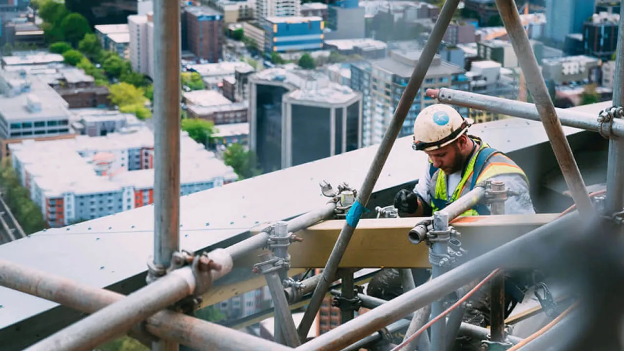 Team of workers on the construction site for BauBau