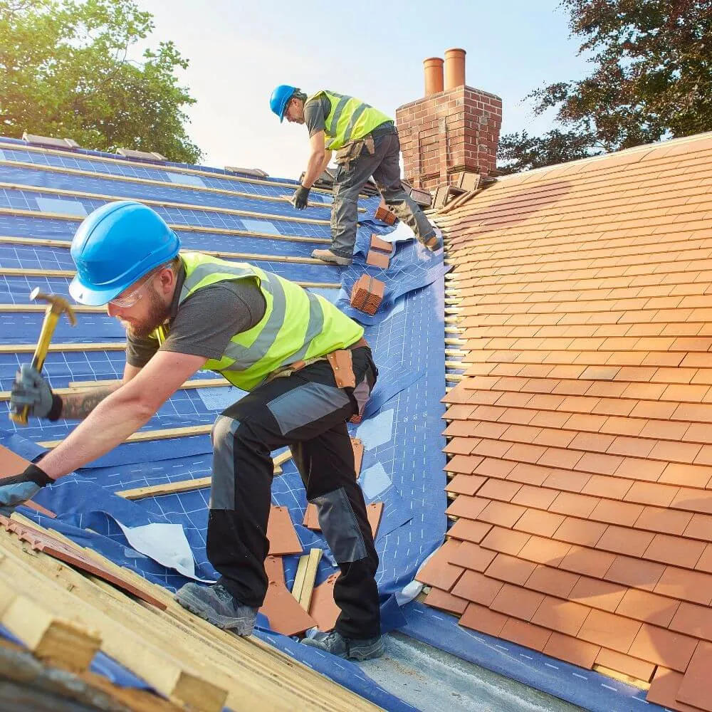 Group of roofers repairing the roof for BauBau Construction project in Wien