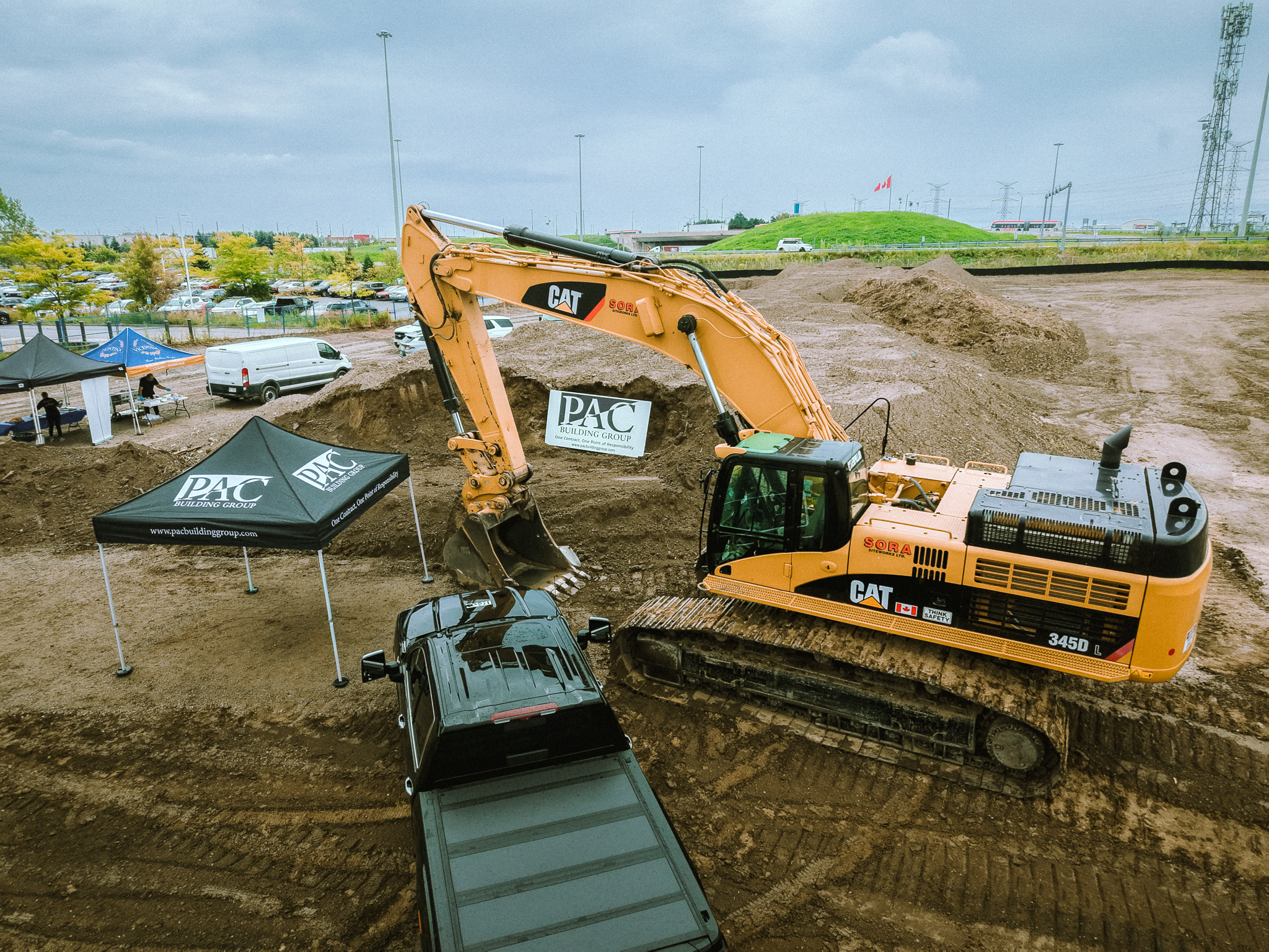 Excavator and PAC tent on the 2777 Meadowpine Boulevard site in Mississauga on groundbreaking day