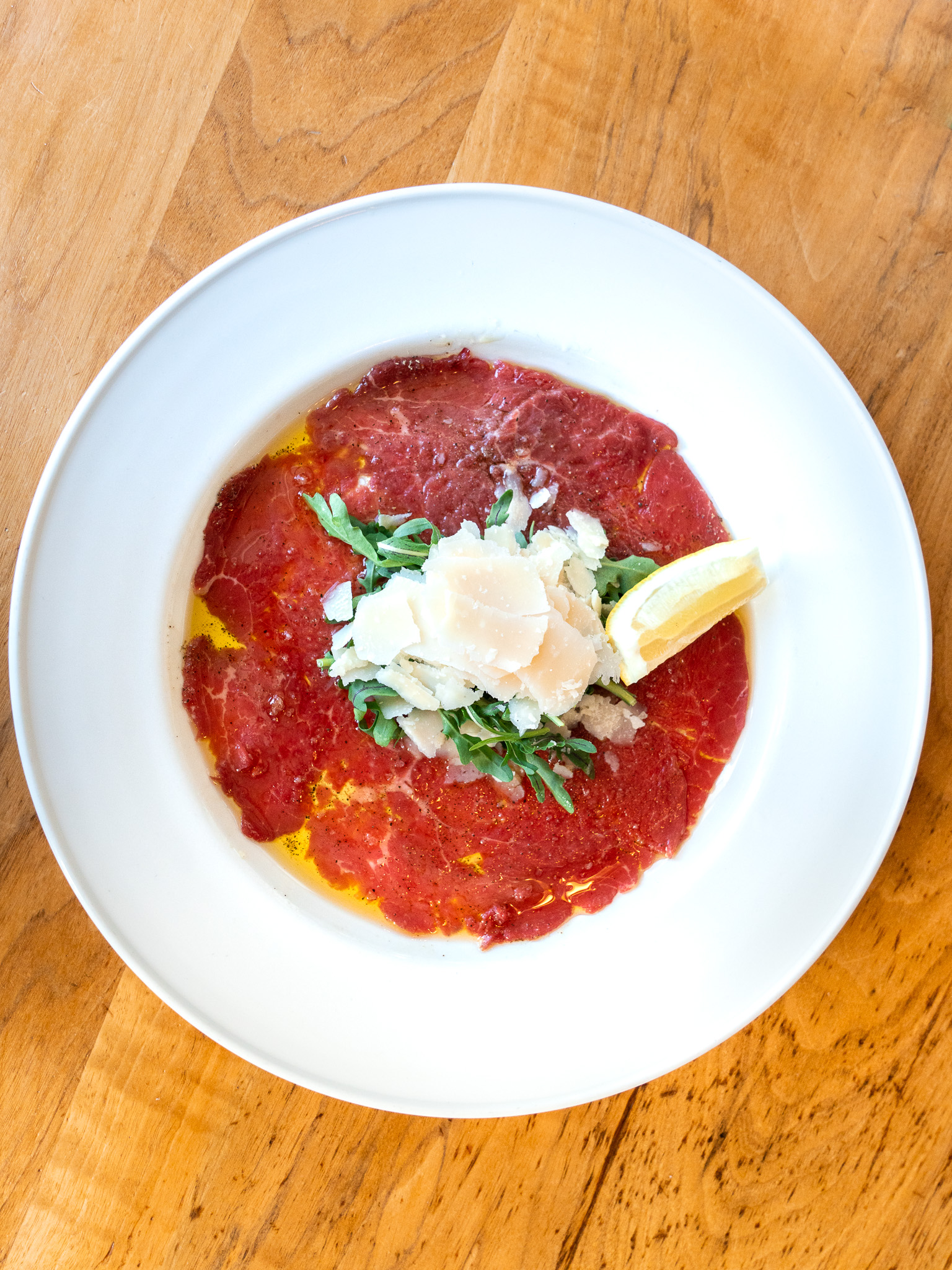 Beef carpaccio with arugula and shaved parmesan at Terroni Sterling