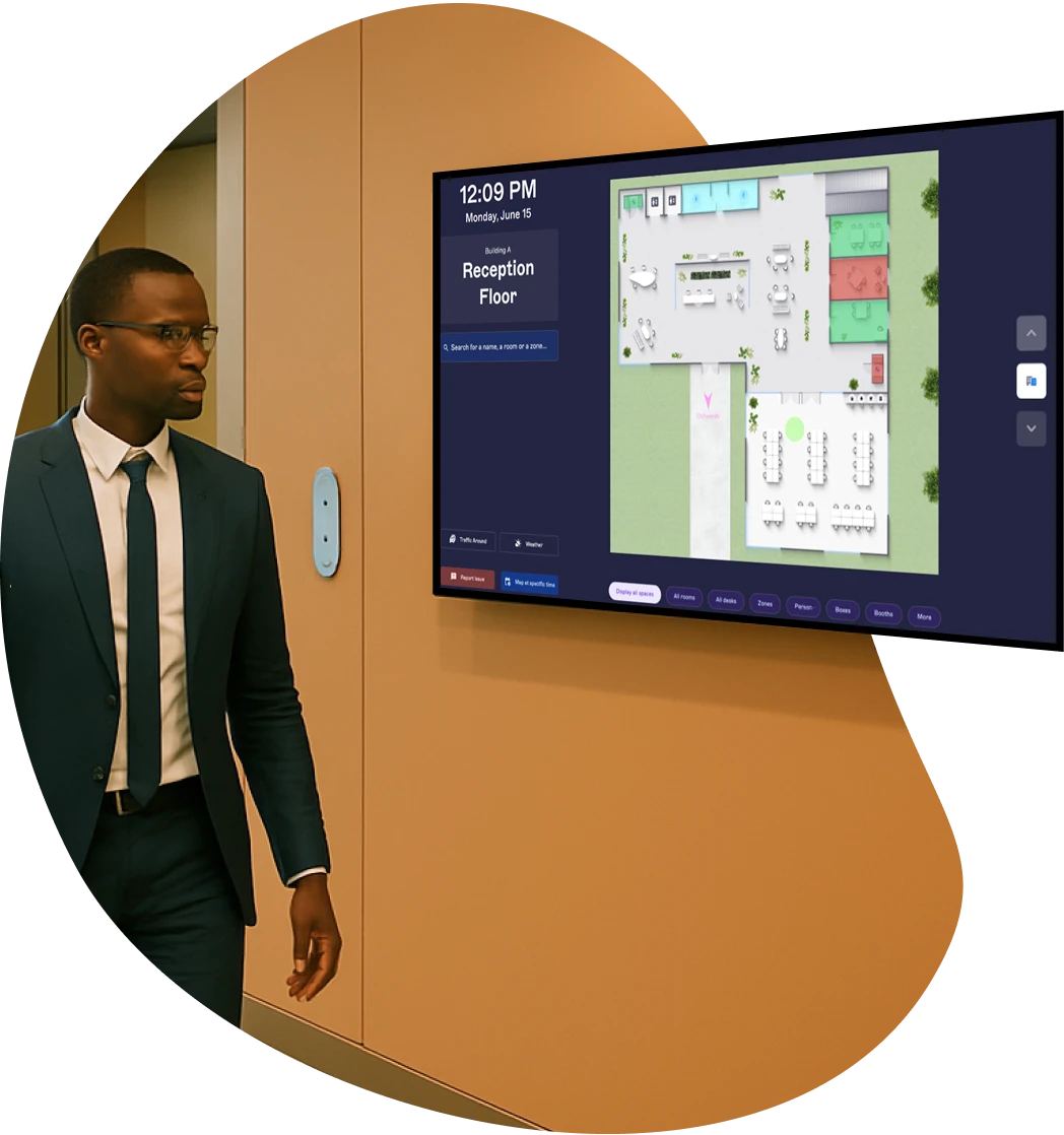 An employee in front of a KioskPad near a lift