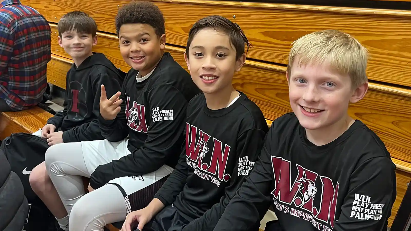 Basketball players running on a court for warm ups