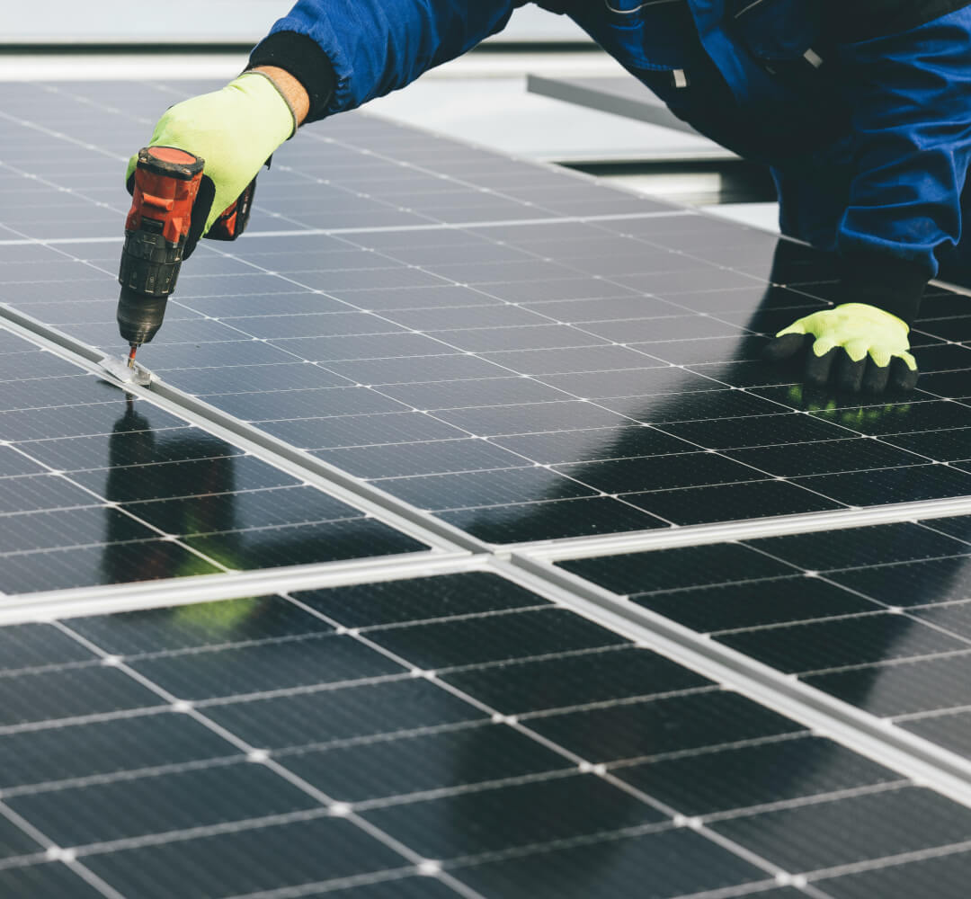 A technician installs a solar panel