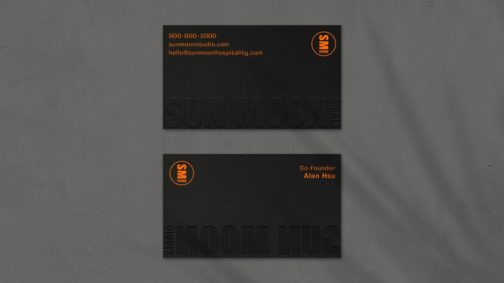 Sun Moon Studio business card design in black with orange accents.