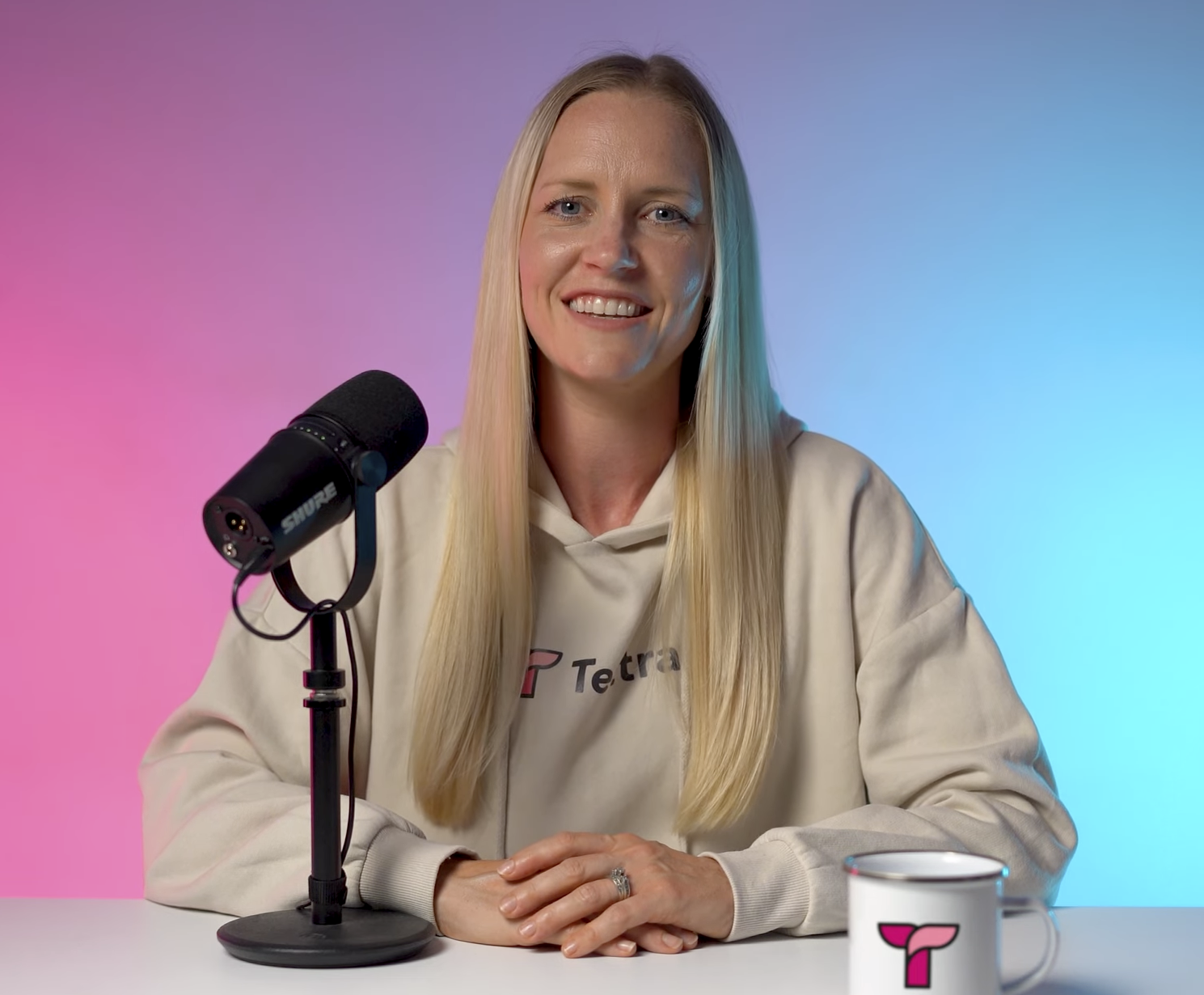 Videodeck spokesperson on a pink and teal set
