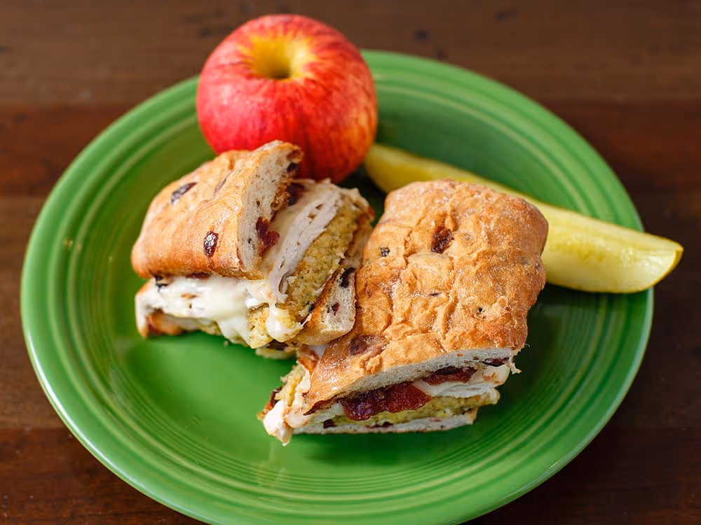 Our award winning favorite! Grilled turkey on a cranberry ciabatta with melted Swiss, cornbread stuffing, cranberry sauce, and mayo
