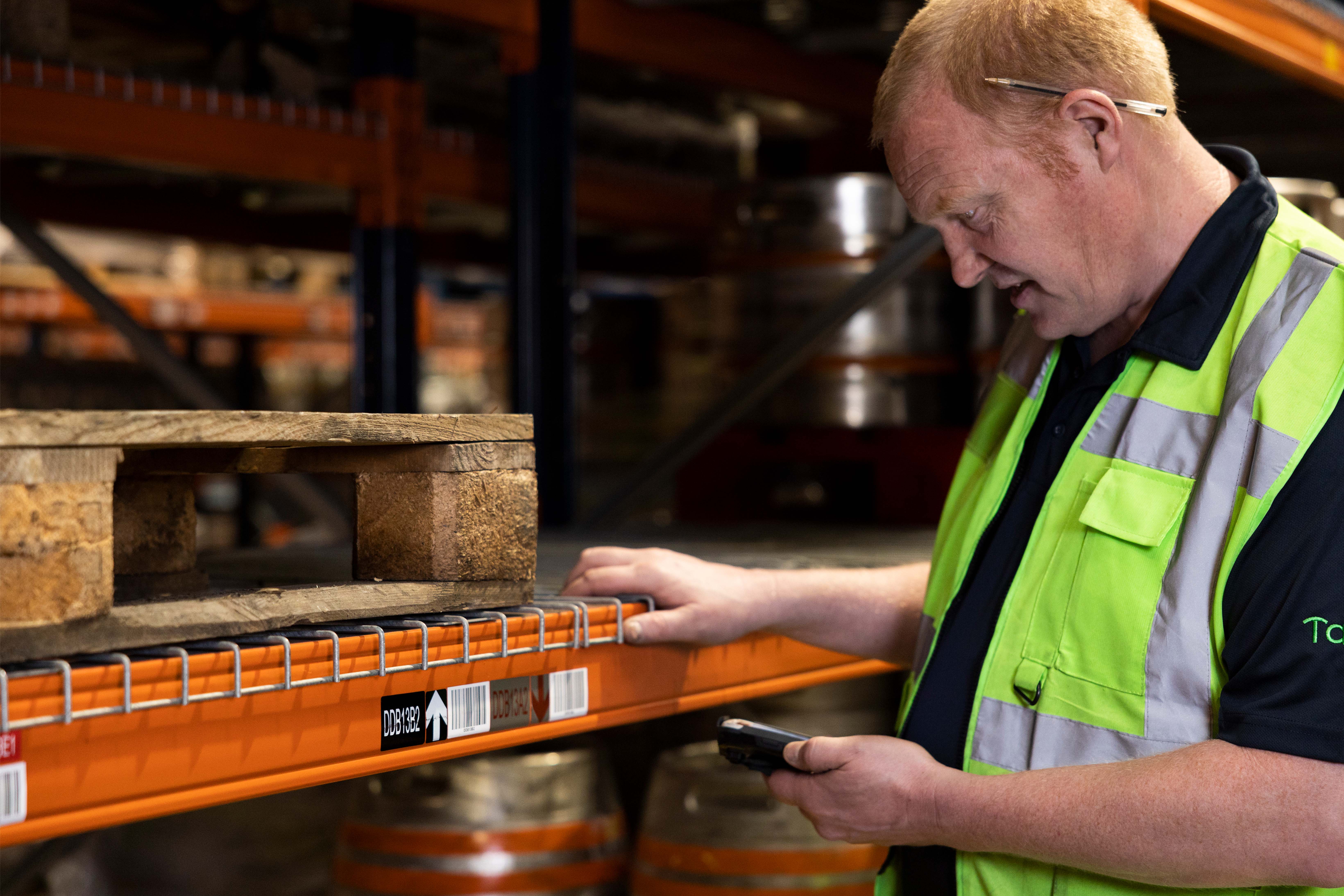 Tap'in warehouse team member scanning pallet barcode