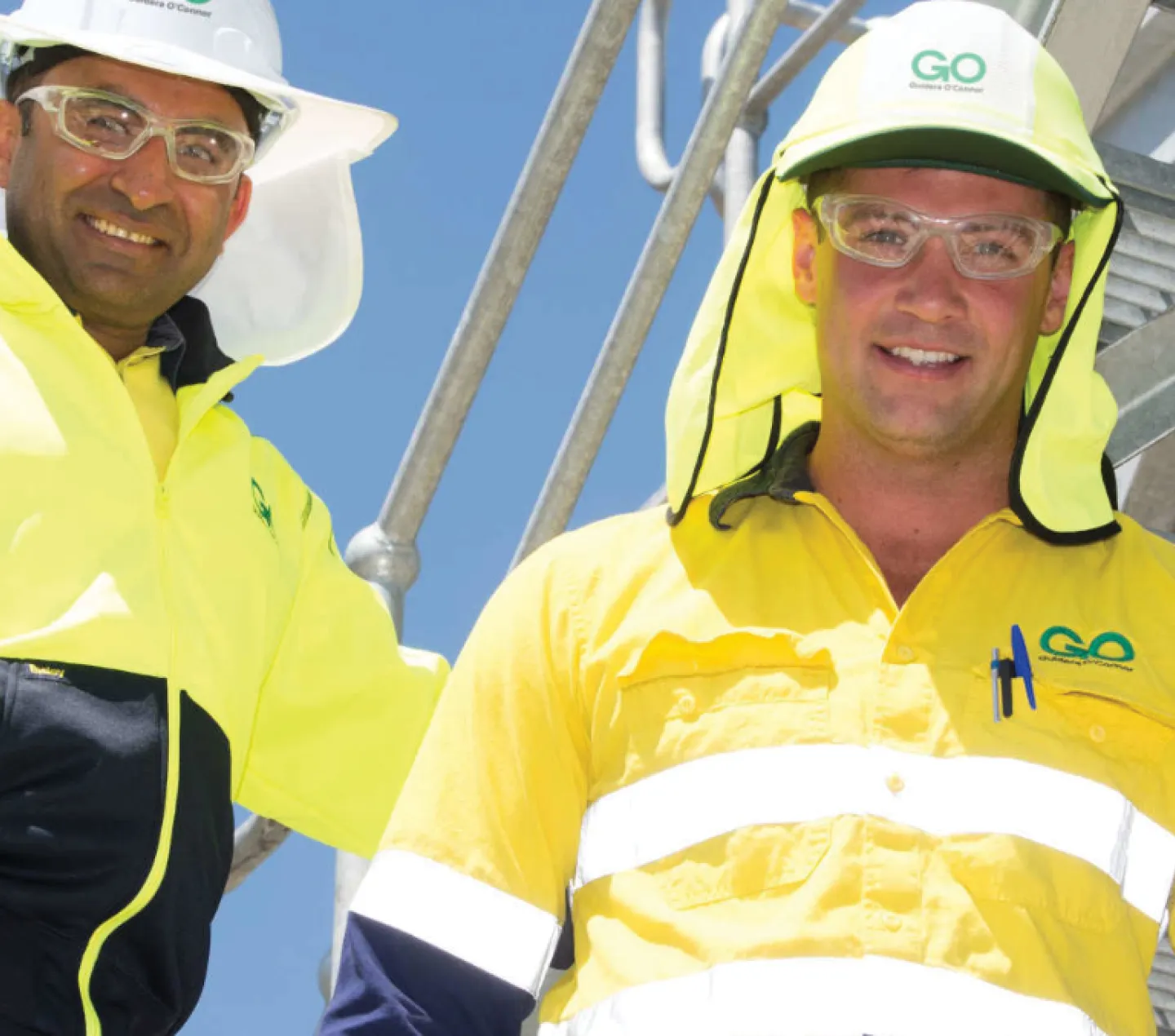 Two GO team members in high-vis on site