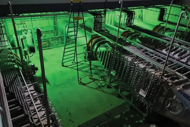 UV disinfection reactors lit green inside the Happy Valley plant