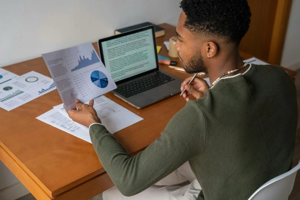 man viewing reports paper