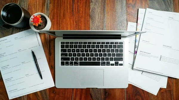 laptop and documents on a desk