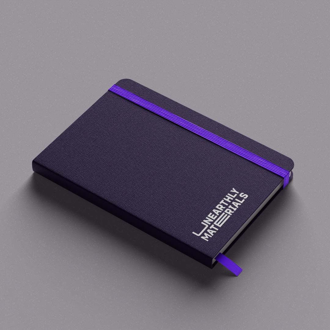 Unearthly Materials purple branded notebook mockup. 